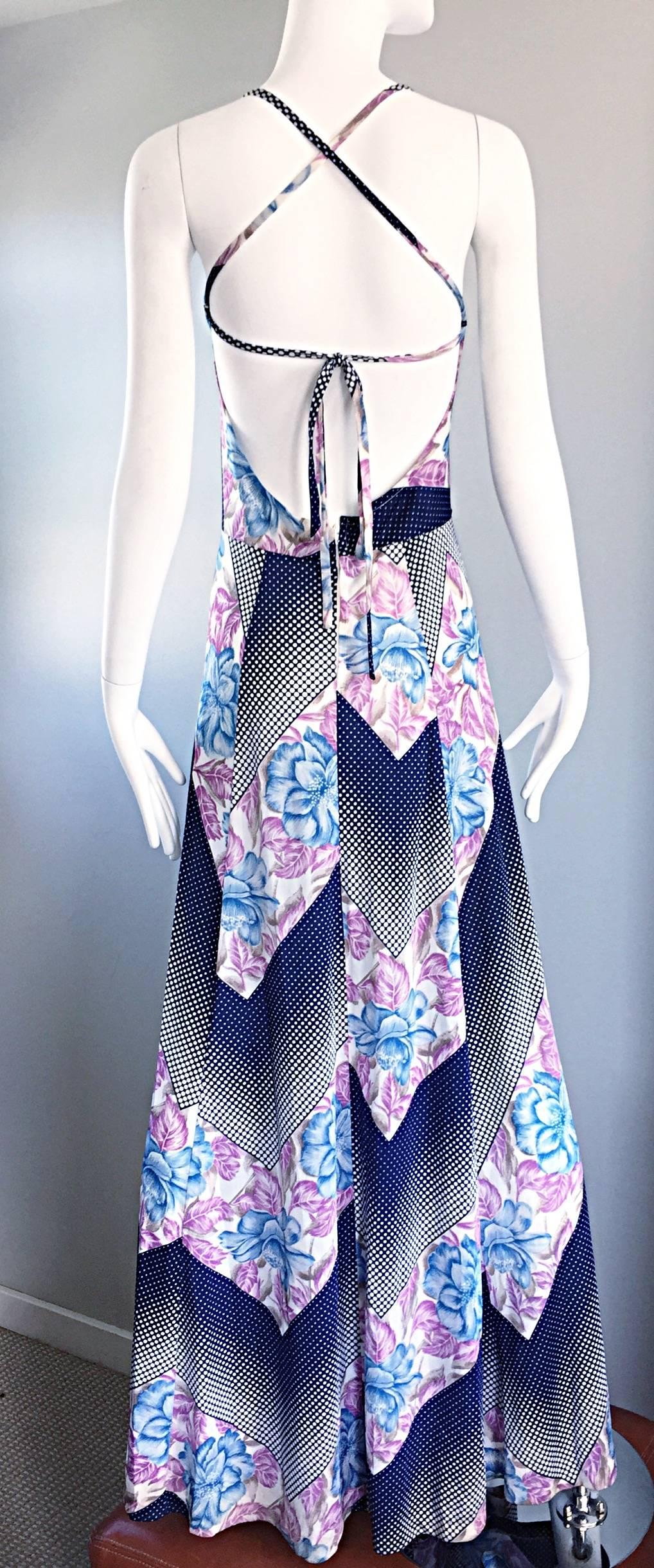 Amazing vintage ERIC LAAGE of Paris 1970s maxi dress! Features an optical illusion op-art print, with navy and white polka dots and 3-D blue and purple flowers throughout. Halter style that wraps around the neck, and cages on the back. Amazing full