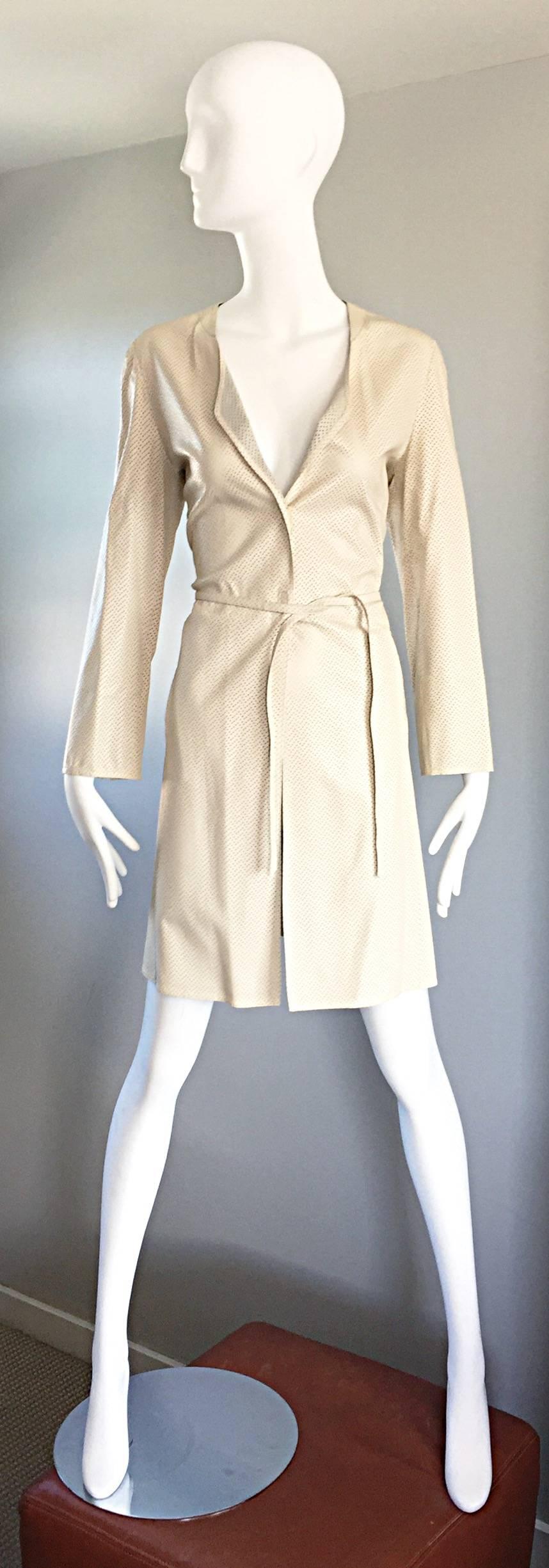 Chic vintage GIROGIO ARMANI 1990s fitted Ivory / beige leather perforated belted trench jacket coat! Features extremely soft Napa leather that is perforated allover. Unique hidden heavy duty plastic snaps to close the jacket. Matching detachable