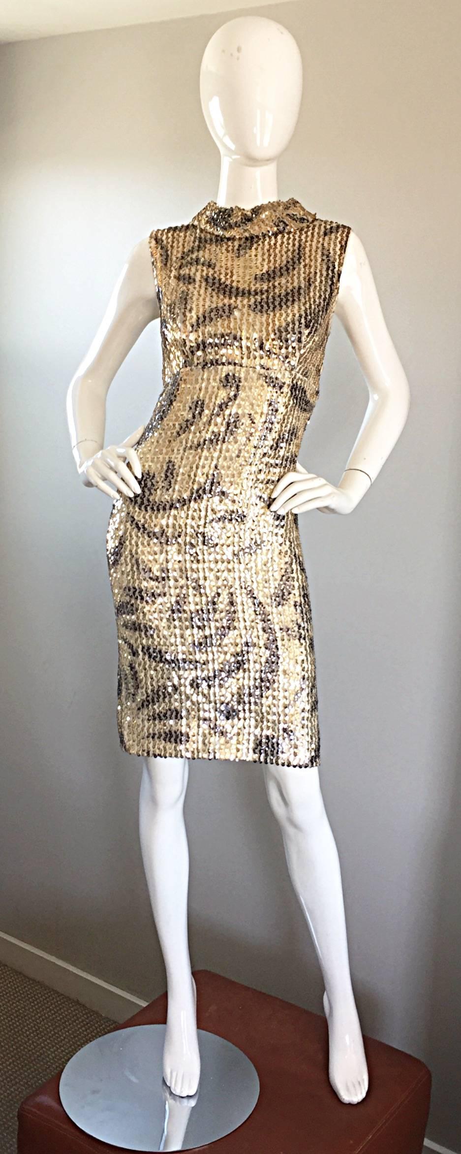 Fantastic vintage 1960s ELINOR GAY gold and black sequined silk wiggle shift dress! A unique technique using some sort of paint and stencils were used in the creation of this insanely gorgeous hand painted dress! Thousands of hand-sewn gold sequins