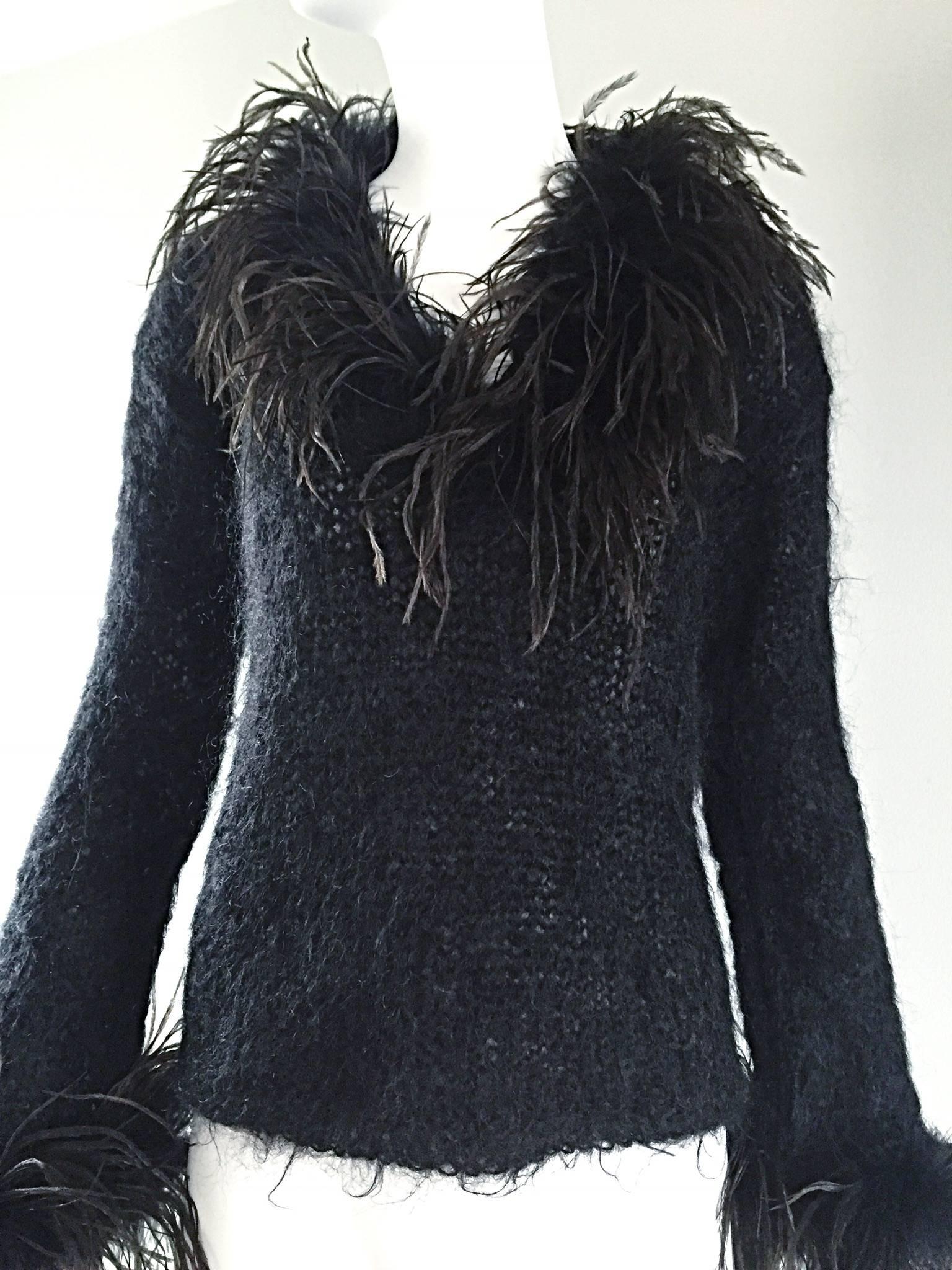 black sweater with feathers