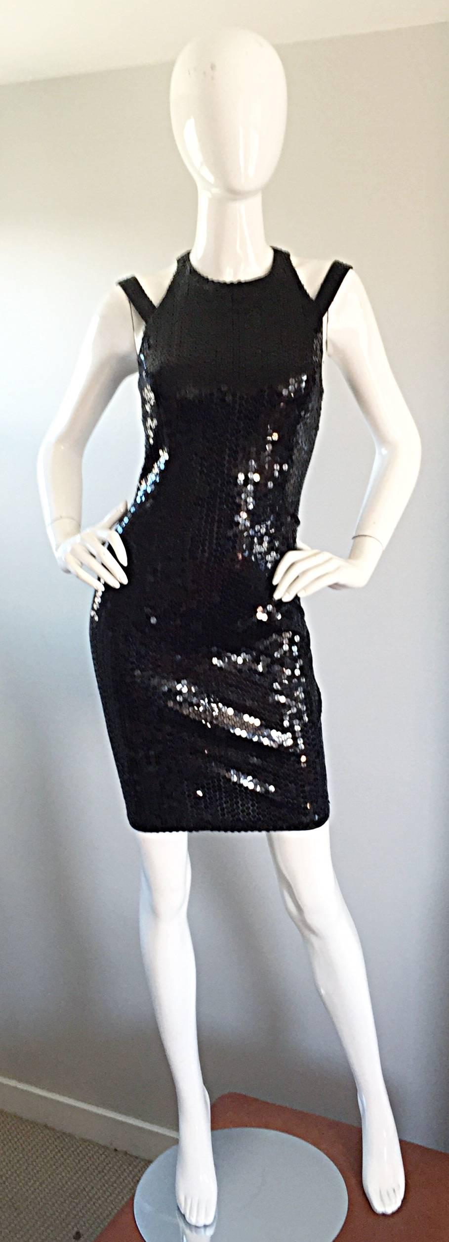 Sexiest vintage DELLA ROUFGALI black sequined caged back 1990s Bodycon mini dress! Features thousands of hand-sewn black sequins throughout the entire dress. Crisscross caged back reveals just the right amount of skin. Such a flattering dress that