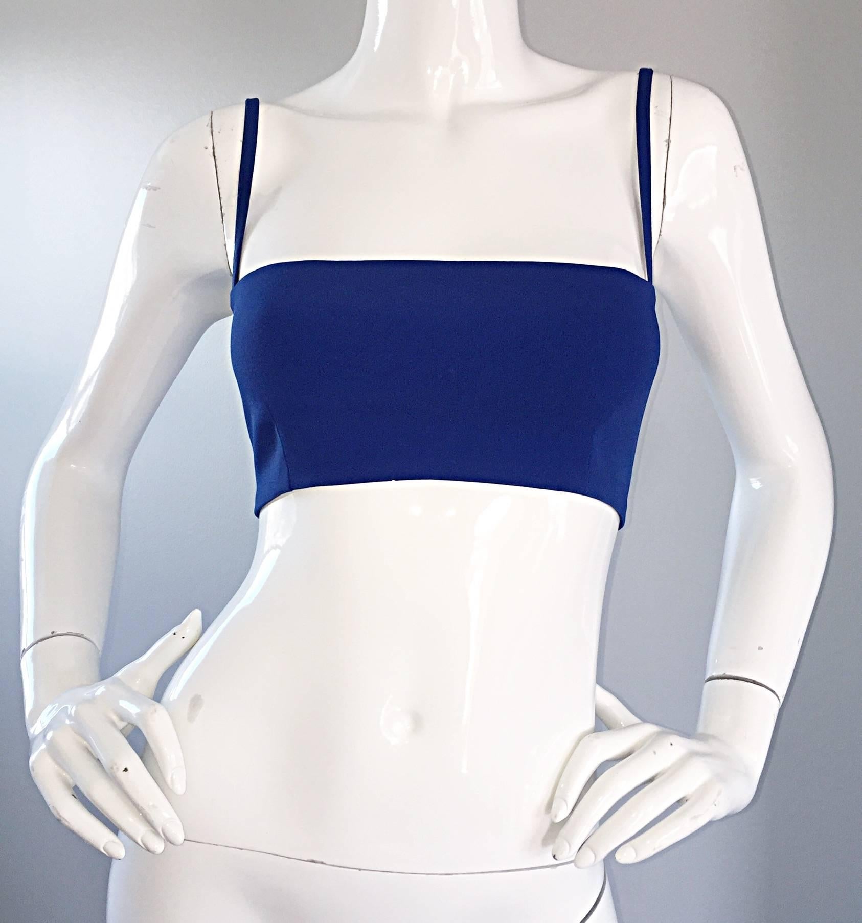 Sexy vintage GIANNI VERSACE VERSUS royal blue stretch crop top! Features an oversized blue zipper at the left side. Can easily be dressed up or down, and great alone or layered. Perfect with shorts, jeans, legging, or a skirt. In great unworn