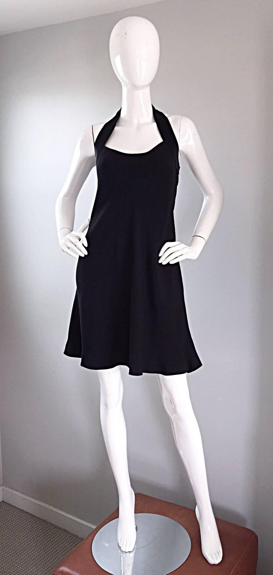 Incredible, rare and super iconic vintage 1990s MOSCHINO CHEAP & CHIC little black dress, with chic peace sign cut-out at the back! Flirty Babydoll fit that flatters many shapes and sizes. Cut-out peace sign with silk satin trim that extends around