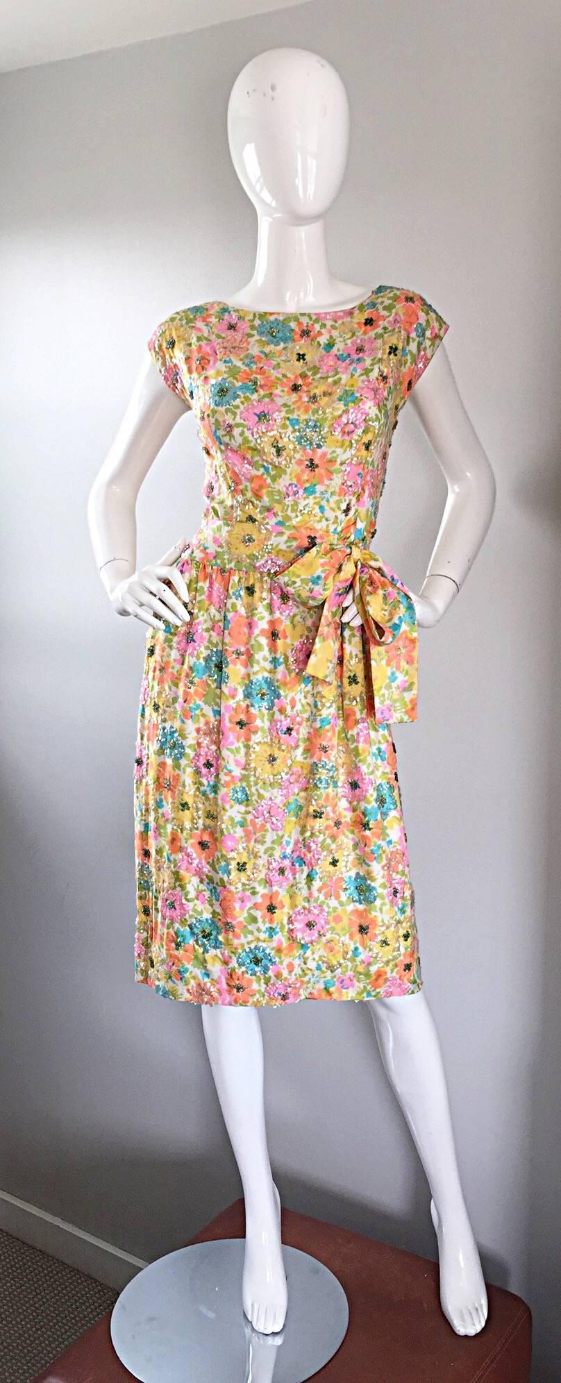 Incredible vintage 50s LARRY ALDRICH silk sequined and beaded dress! Beautiful floral print, with thousands of iridescent sequins and beads hand-sewn throughout. Features an attached bow belt that ties to the left side of the waist, making this