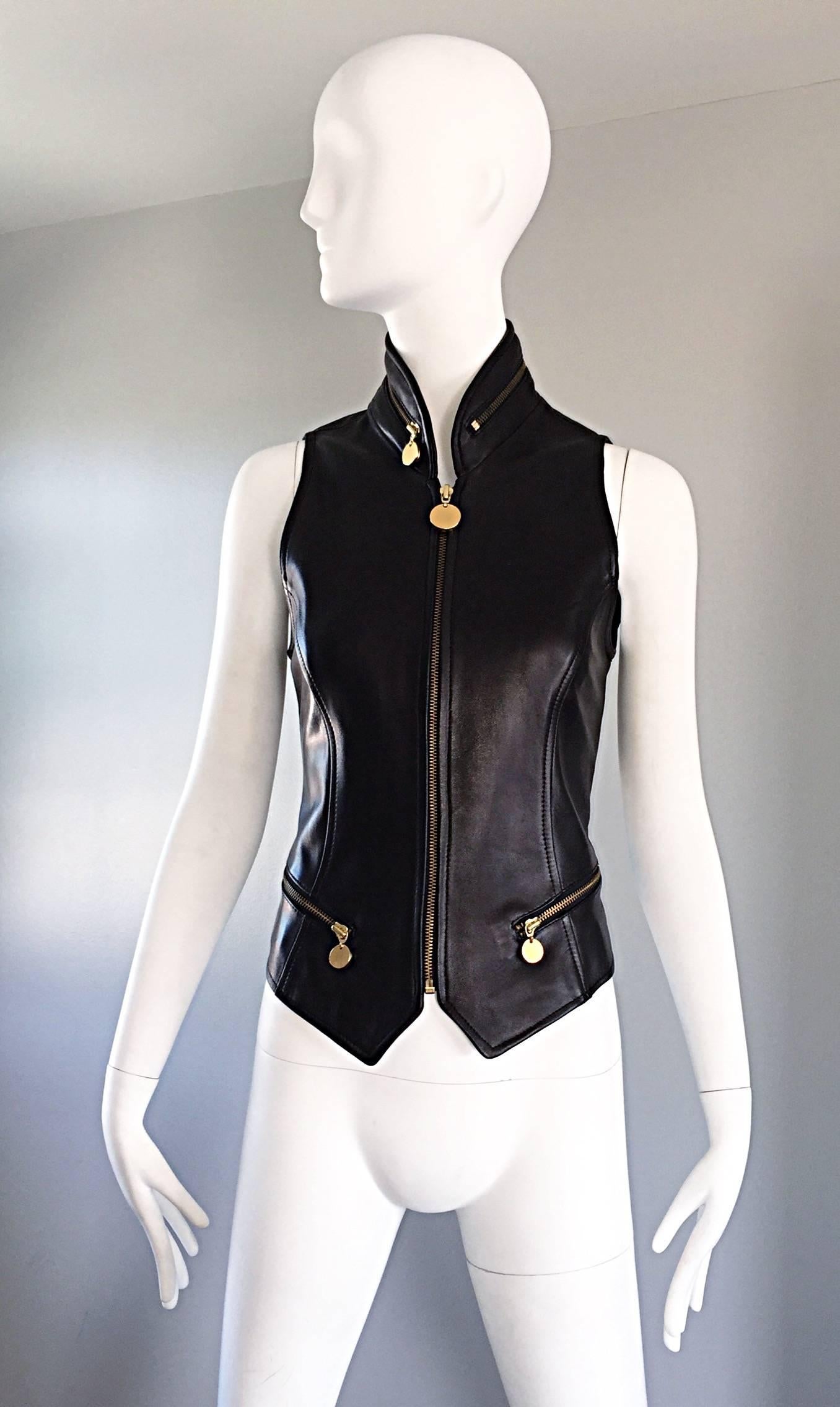Chic vintage 1990s / 90s DONNA KARAN Black Label Lambskin black leather vest! Incredibly flattering tailored piece by this iconic designer. Features gold zipper up the bodice, two gold zippers at the front pockets, and a gold zippered pocket along