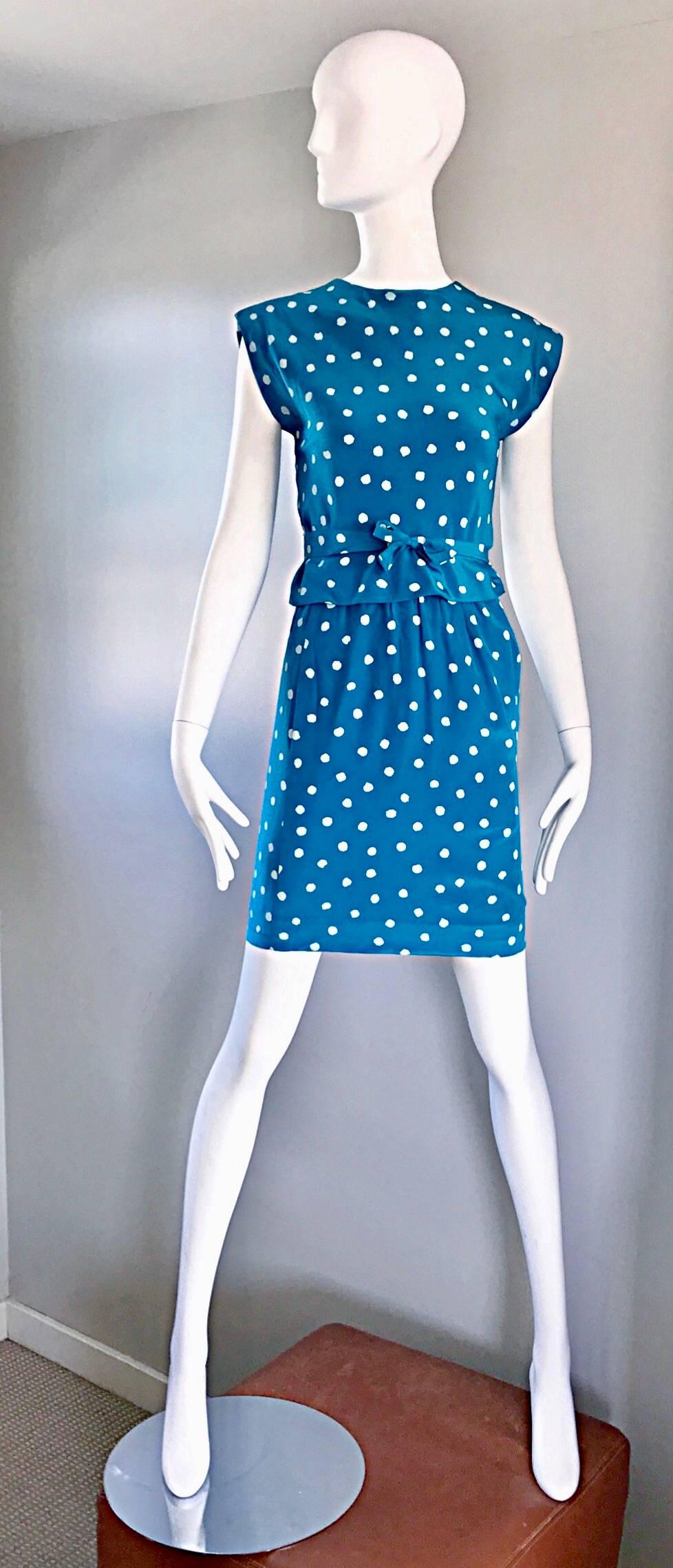 Gorgeous vintage OSCAR DE LA RENTA bright blue and white polka dot silk skirt and wrap blouse ensemble! A flattering wrap blouse that ties in the front. High waisted fitted pencil skirt. Pockets at both sides of the waist. Hidden zipper up the back