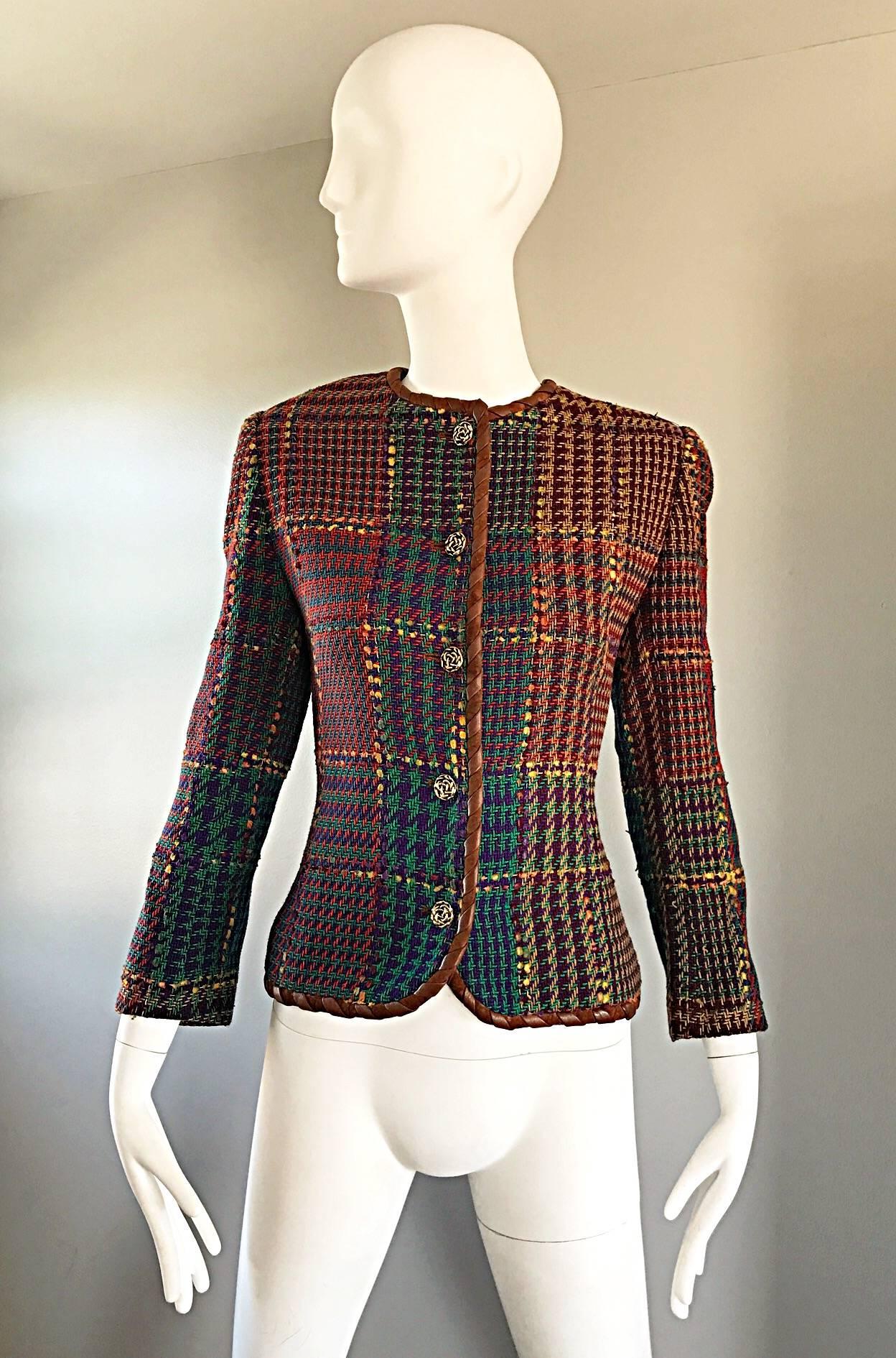 Chic vintage 90s EMANUEL UNGARO colorful autumnal herringbone blazer! Features warm tone of orange, purple, green, blue, and yellow throughout. Trimmed with saddle colored whip stitch leather. Decorative brass buttons up the bodice. Fully lined.