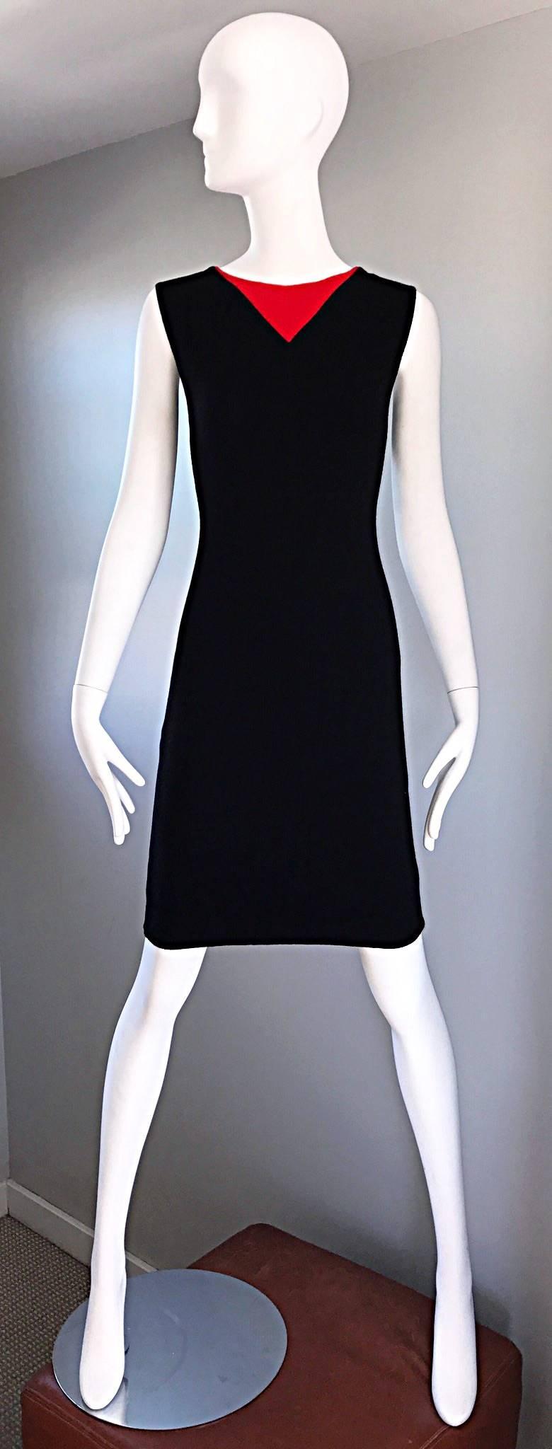 Chic vintage 1960s BILL BLASS wool shift dress! Jet black soft virgin wool, with a bright lipstick red triangle detail at the neckline. Classic flattering shape. Full metal zipper up the back with hook-and-eye closure. Fully lined. A different, but