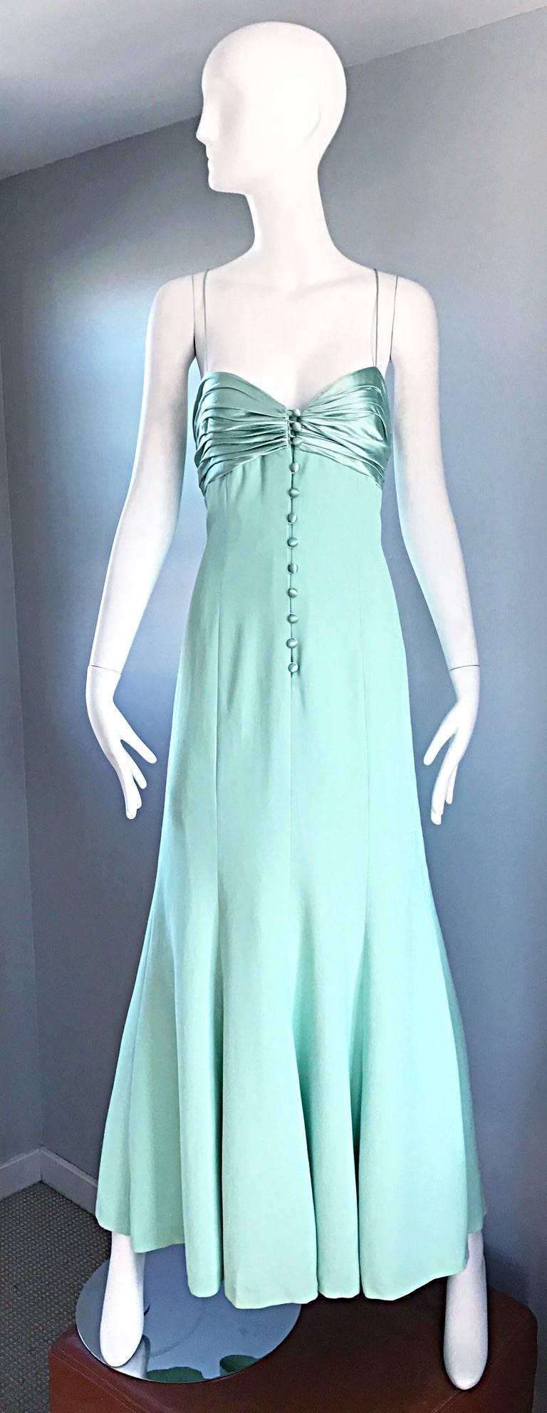 Beautiful vintage VALENTINO light green gown! Flattering and flirty fit. Silk covered buttons up the bodice, with a zipper under. Thin silk spaghetti straps criss-cross in the back. Fully lined. Looks amazing on, and is perfect for any day or