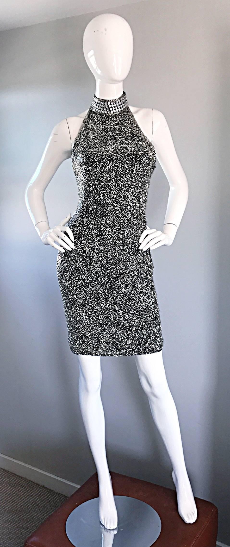 Sexy vintage 1990s / 90s LILLIE RUBIN black and silver heavily beaded silk cocktail mini dress! Features thousands of hand-sewn silver beads throughout the entire dress. Oversized silver crystals adorn the back panel and the neck. Super flattering