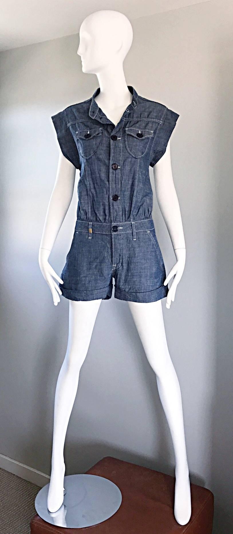 Stylish early 2000s MISSONI blue jean denim one piece romper! Features navy blue buttons up the bodice. Cuffs at each leg opening. Super soft cotton denim. Belt loops around the lower waist--looks great alone or belted. Pockets at each side of the