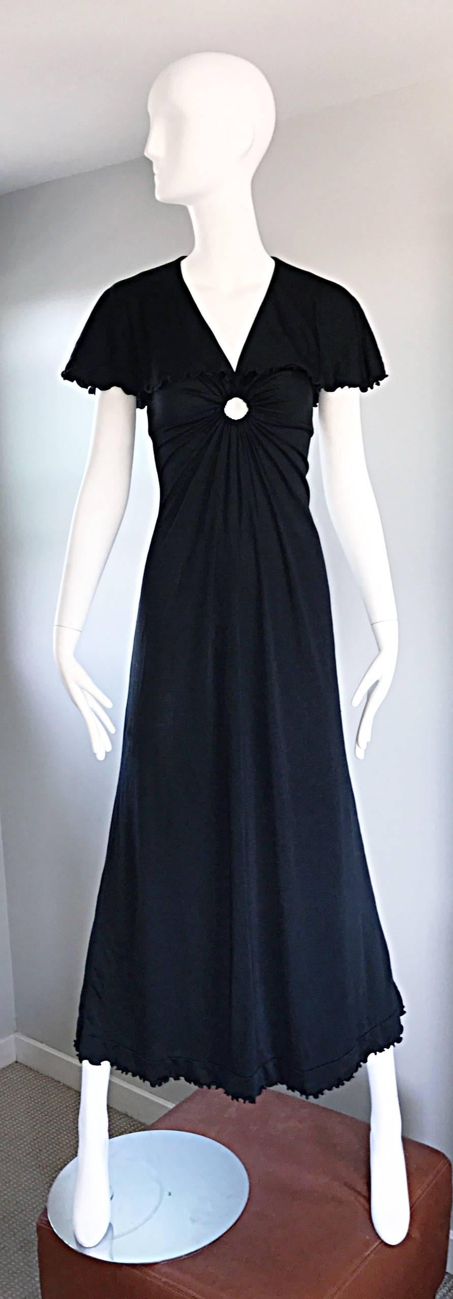 Sexy and flattering vintage 1970s GIORGIO SANT'ANGELO black jersey maxi dress / gown, with keyhole at center bust! Flattering fitted stretch bodice features gathers leading to the center keyhole. Chic attached caplet at shoulder. Forgiving full