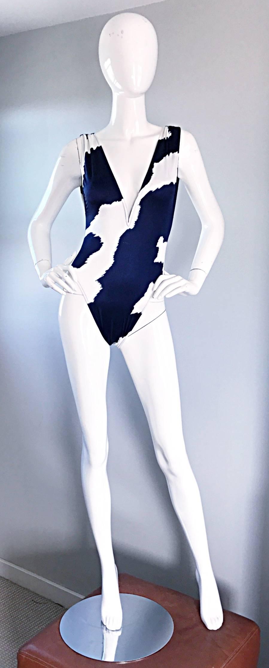 Amazing vintage 1990s 90s BILL BLASS navy blue and white abstract printed one piece swimsuit or bodysuit! Features a vibrant navy blue color that contrasts perfectly against the white backdrop. Sexy plunging bust line reveals just the right amount