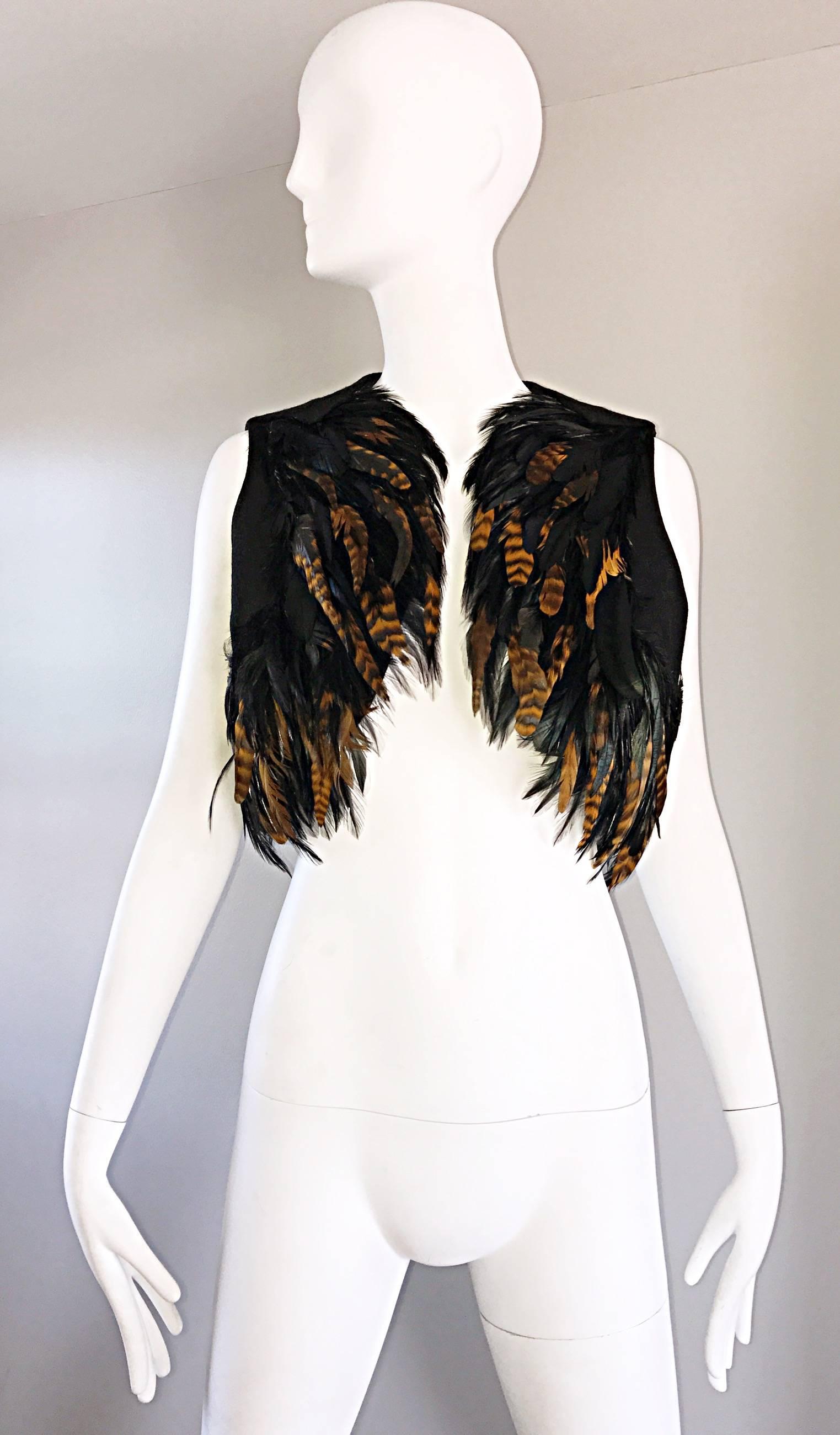 Incredible vintage JOSPEH MAGNIN 1970s feather and wool cropped vest! Features hundreds of brown and black feathers throughout. Black wool back. Great with jeans, shorts, a skirt, trousers, or over a dress. In great condition. Made in USA.