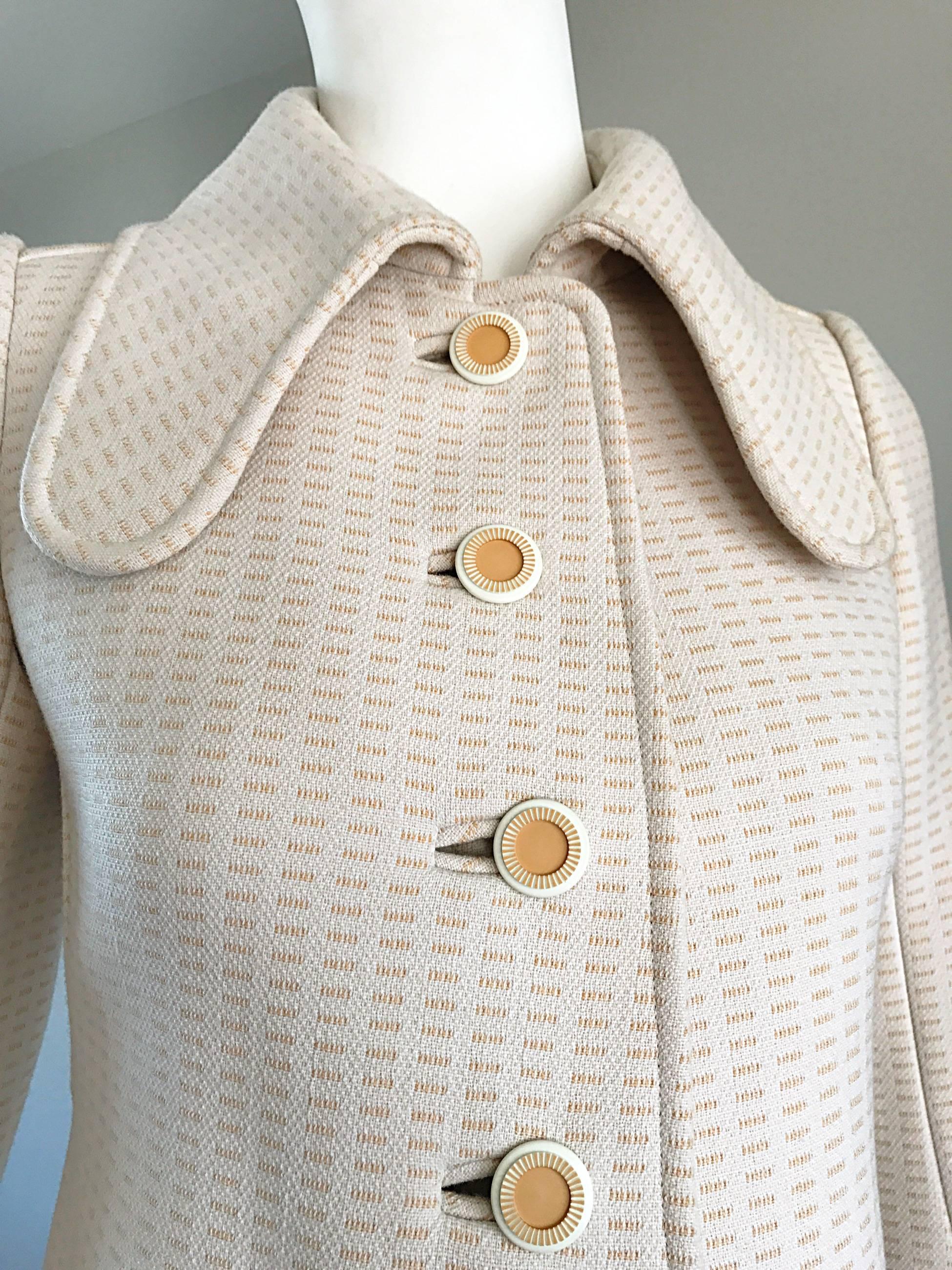 Rare 1960s COURREGES HAUTE COUTURE numbered off white / ivory colored wool coat! Words cannot even begin to describe how beautiful and well m add this jacket is! Completely hand-sewn, with heavy attention to the details. Signature looped collar, and