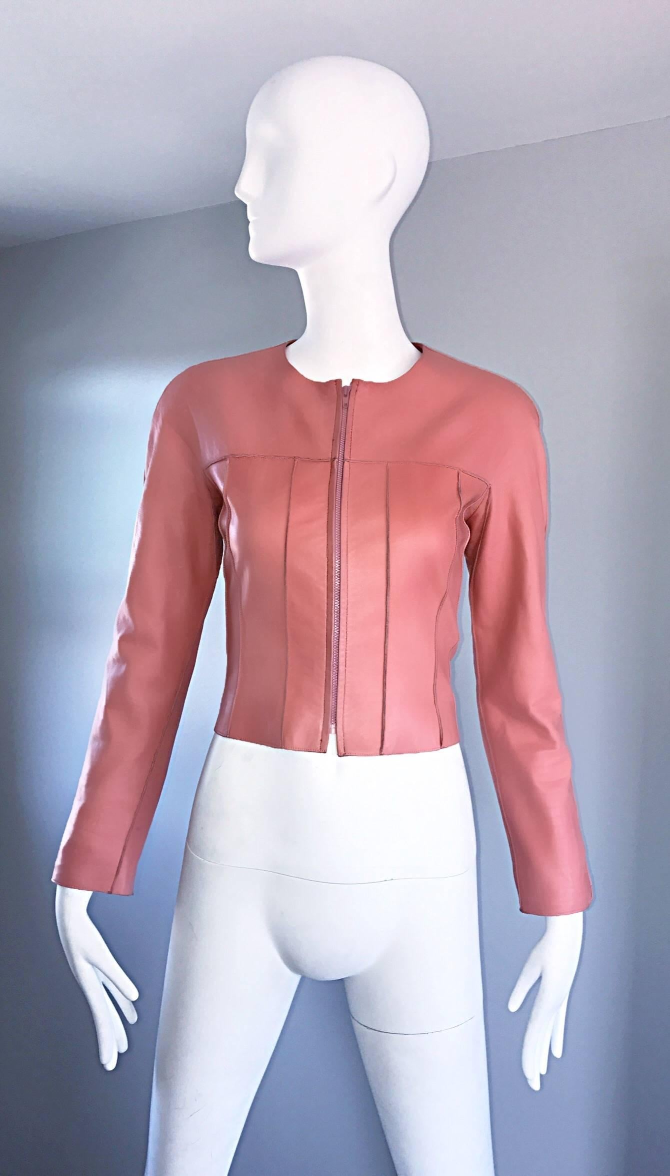 Amazing and rare vintage CHANEL 1990s / 90s bubblegum pink lambskin leather cropped jacket! Super soft leather. Full zipper up the front. Expertly tailored, with a fantastic fitted bodice, and tailored long sleeves. Intricate stitching throughout.