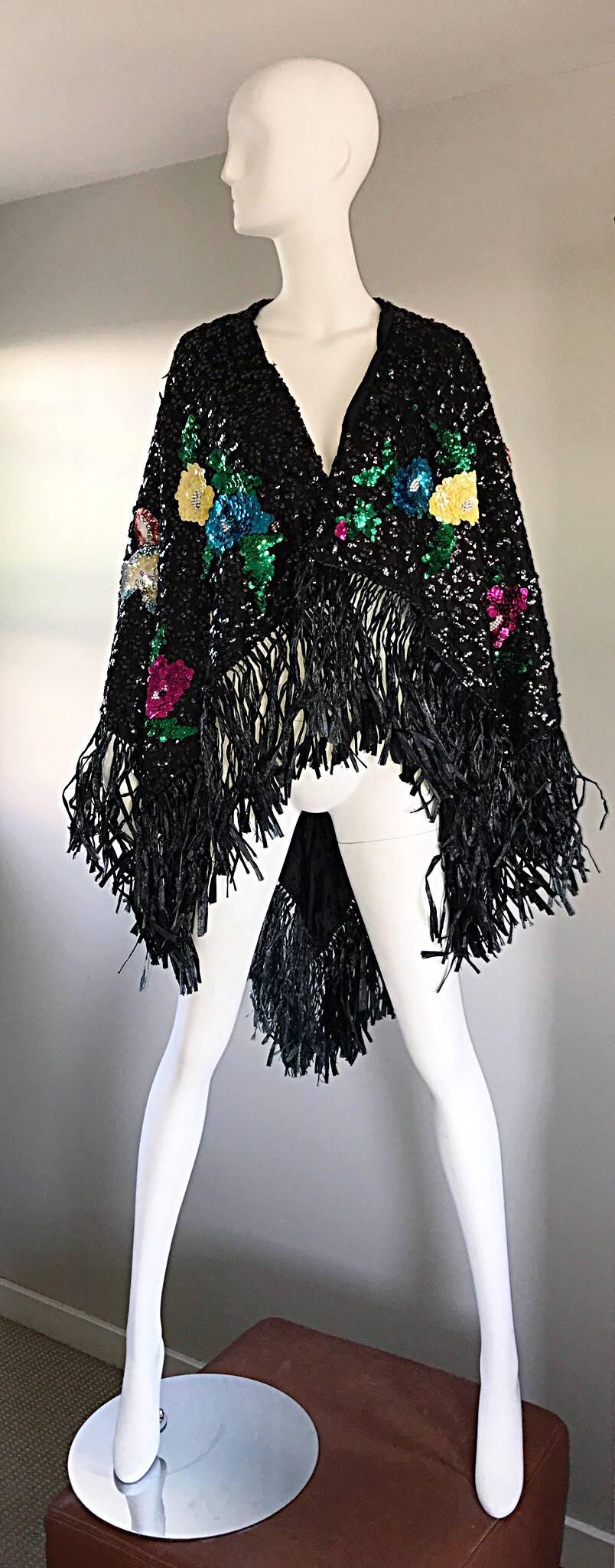 Amazing vintage 1970s black oversized sequin piano shawl! Features thousands of hand-sewn sequins with sequined and beaded flower and foliage appliqués throughout. Black raffia / straw fringe at the edges. Can easily be dressed up or down. Great