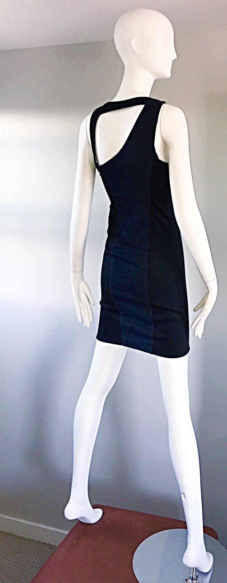 Sexy and rare 90s HELMUT LANG dark blue jean and black bodcon asymmetrical mini dress! Features a denim front, with a black stretchy back. Asymmetrical bust line in the front, and a bondage style cut-out back. Hugs the body in all the right places,