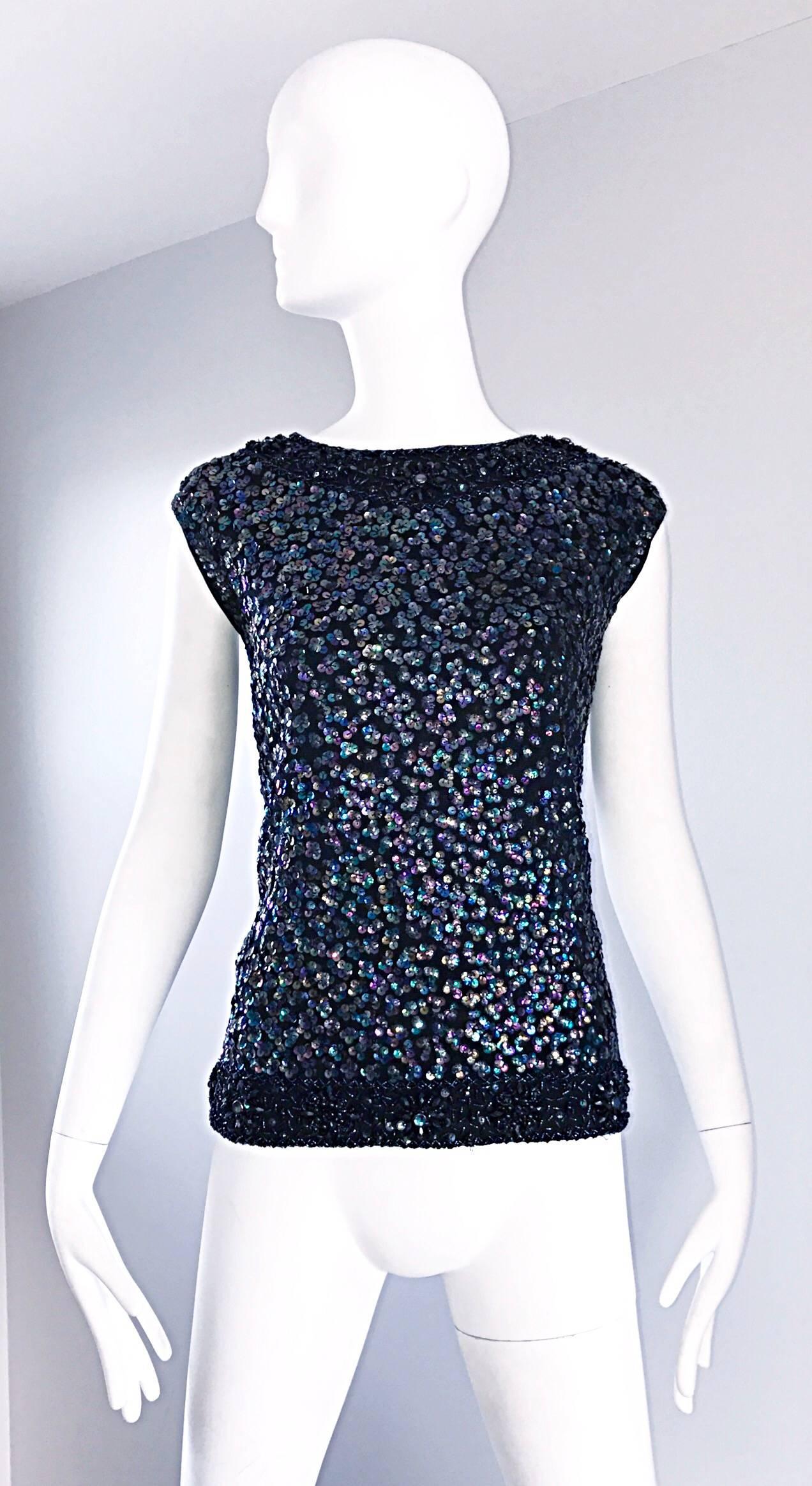 Beautiful larger size 60s LONDONER sleeveless sweater blouse! Features a soft black Virgin wool blend (70% Wool, 20% Angora, 10% Nylon). Thousands of hand-sewn iridescent sequins and beads throughout. Beaded collar and hem. Full metal zipper up the