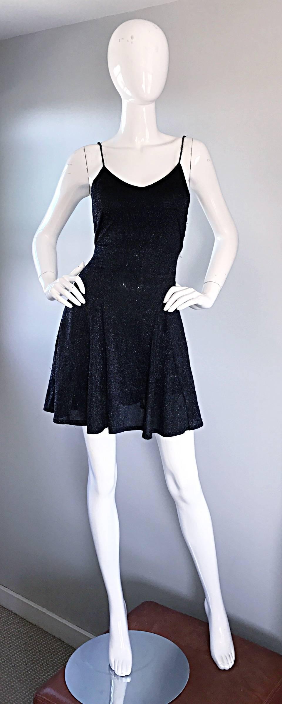 Remarkable vintage BETSEY JOHNSON black metallic Lurex skater dress! Features a black and silver metallic Lurex. Body hugging bodice, with a flared skater skirt. So, 