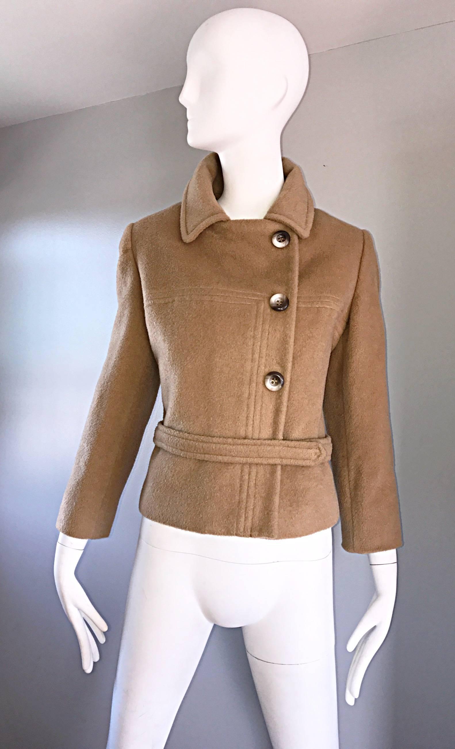 Chic and beautiful 1960s SAKS 5TH AVE perfect camel color cropped wool jacket! Sleek tailored fit, with interesting stitching detail on the front. Attached wrap belt with multiple hidden snaps. Mock horn buttons up the front, with hidden snaps to