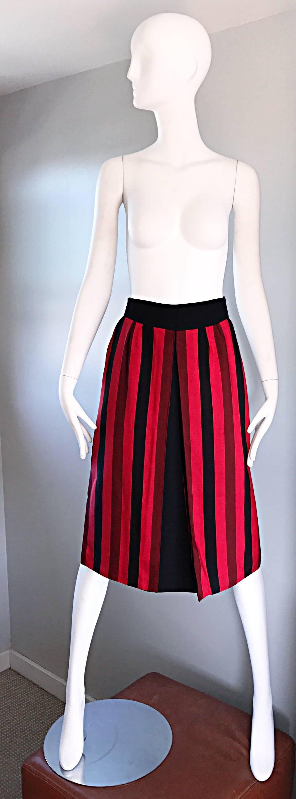 Chic vintage black and red vertical striped (late 1970s 70s / early 1980s 80s)  A-Line skirt by hard to find Parisian label ANNE RUBINSTEIN COUTURE! Vertical stripes on the front with vibrant hues of two different reds, and black. Solid black on the