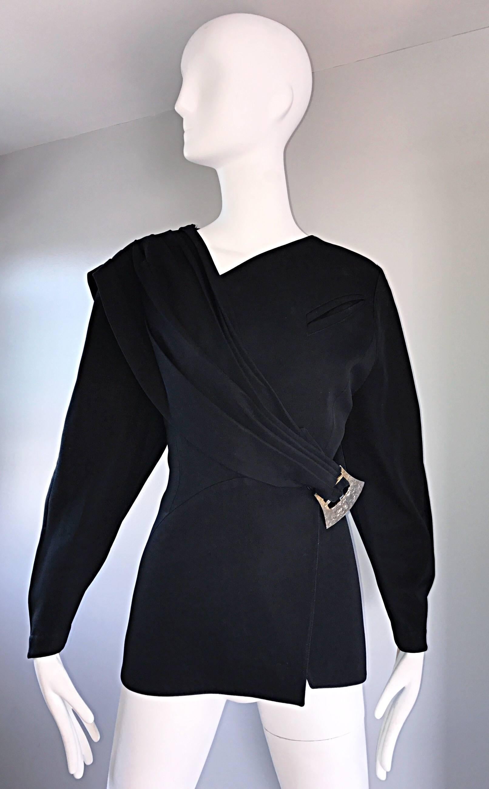 Iconic vintage 80s THIERRY MUGLER black Avant Garde blazer jacket! Features a pleated sash that crosses over the side front, with a hammered silver buckle closure at side waist. Incredible full sleeves, with signature raising at the outer seams, and