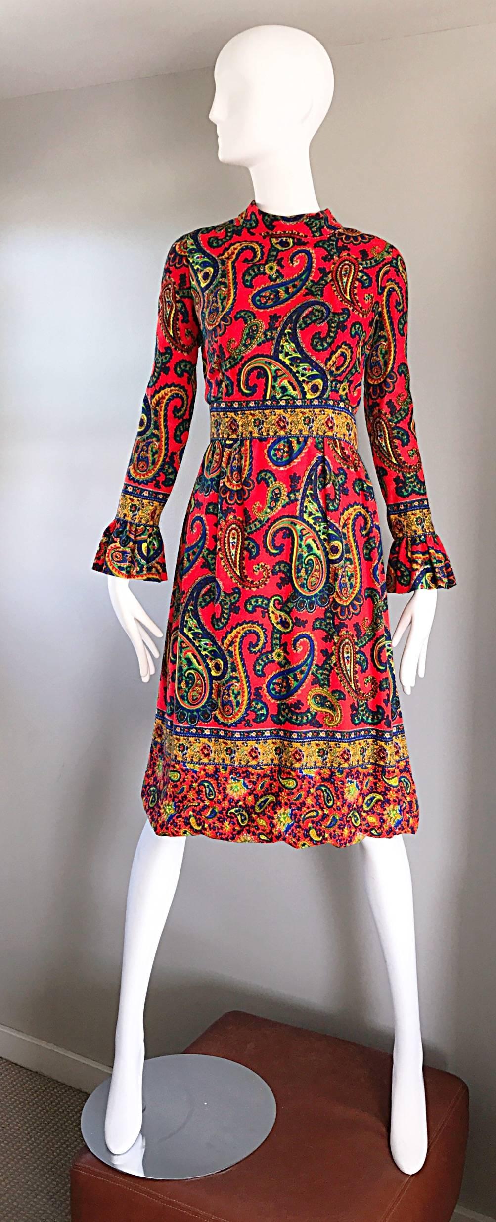 Brilliant vintage late 1960s PAT SNADLER bright orange paisley print psychedelic  A-Line / empire waist dress! Features allover paisley prints in vibrant blue, green, yellow, orange, and red throughout. Flattering fit, with sleek tailored long