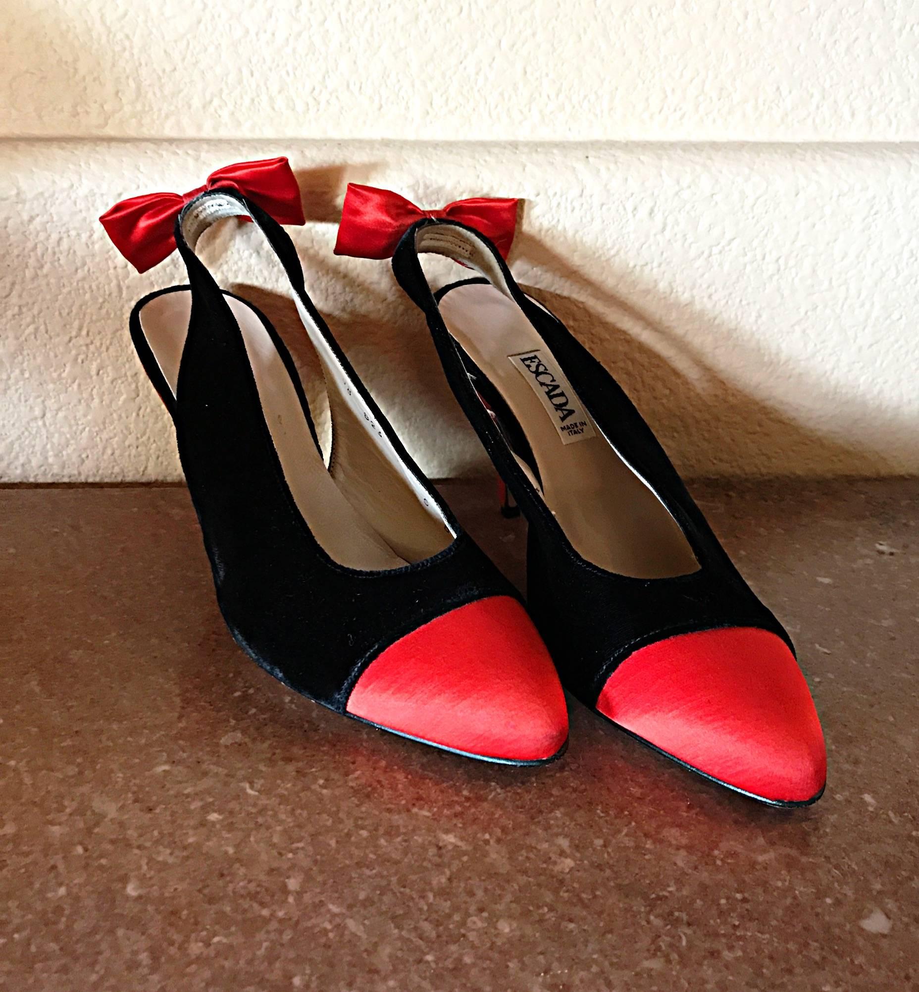 Gorgeous, never worn vintage 1990s ESCADA sling back bow pumps! Red silk cap toe, with black silk velvet. Adorable red bows at heels. Perfect for the upcoming Christmas Holiday season! Can easily be dressed up or down. Great with jeans, a skirt,