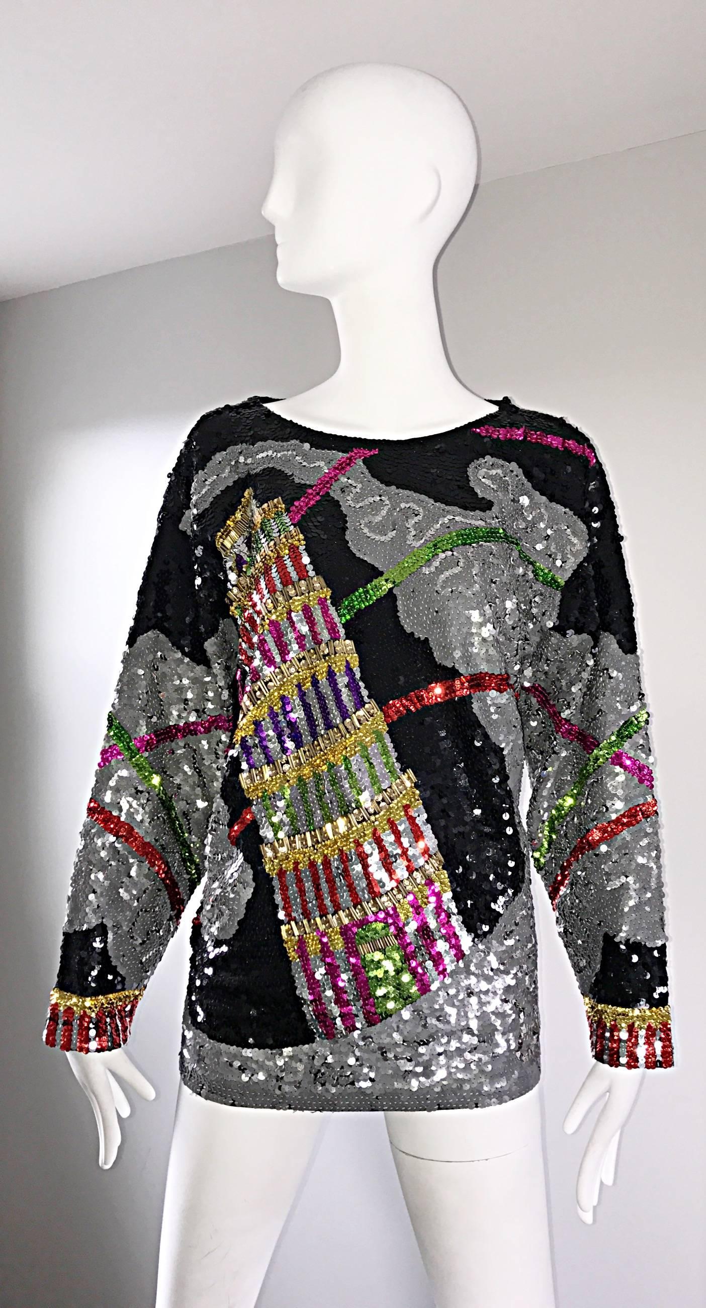 Amazing vintage 'Leaning Tower of Pisa' fully sequined novelty cotton top! Thousands of colorful and black hand-sewn sequins throughout. The perfect statement worthy piece! Single button closure at top back neck. Dolman sleeves and lots of stretch