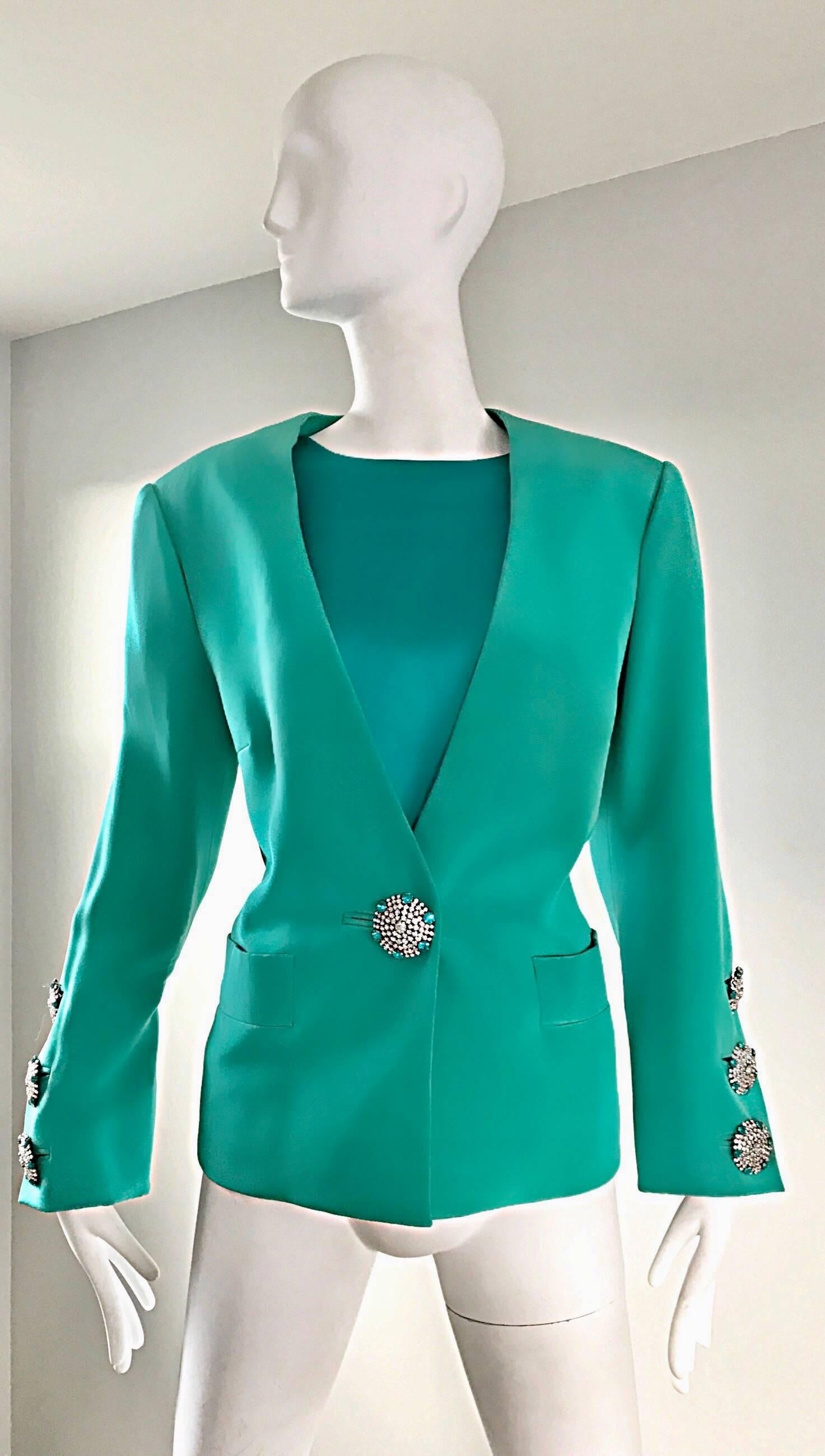 Stunning vintage YVES SAINT LAURENT Haute Couture numbered Kelly green silk jacket and top! Striking vibrant shade of green. Phenomenal diamanté rhinestone oversized buttons--three at each cuff, and one at the front bodice. Two pockets (one at each