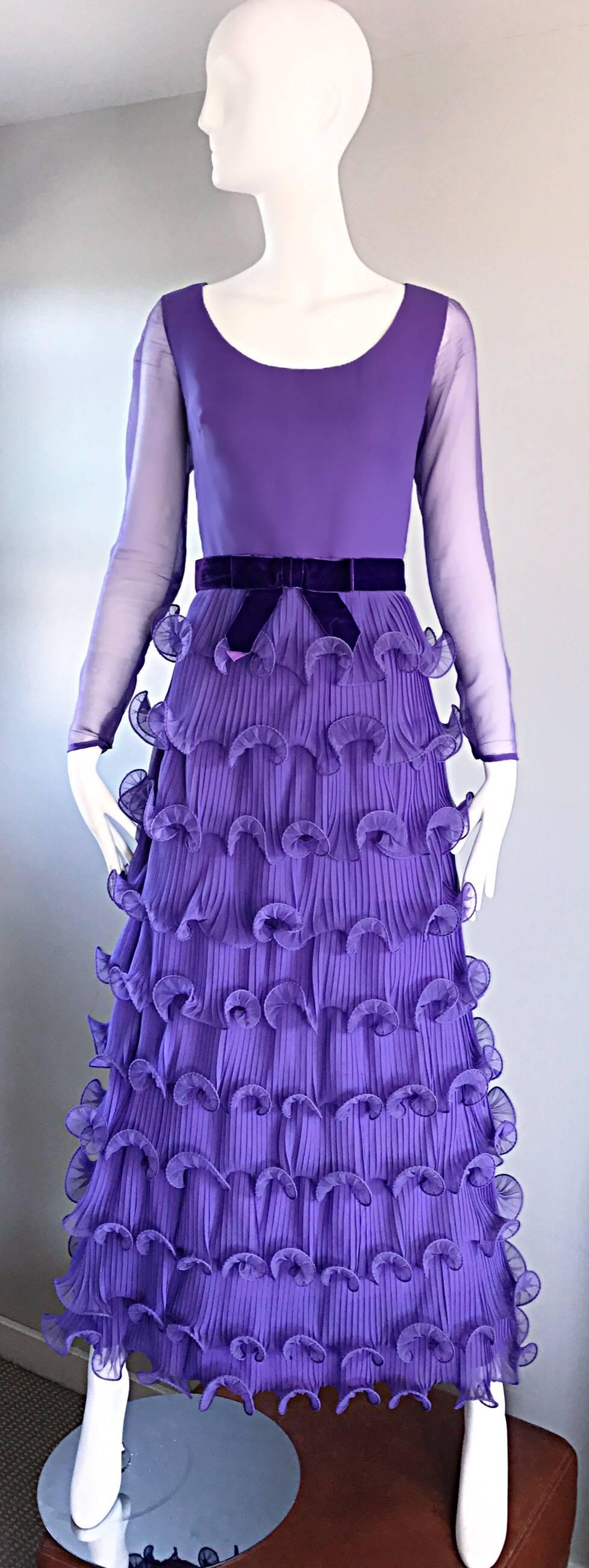 Gorgeous vintage 70s ELLIETTE LEWIS lavender light purple chiffon maxi dress! Features a fitted bodice, with a full ruffled skirt. Attached purple silk velvet bow belt with hook-and-eye closures up the back. Semi sheer long sleeves with hidden snaps