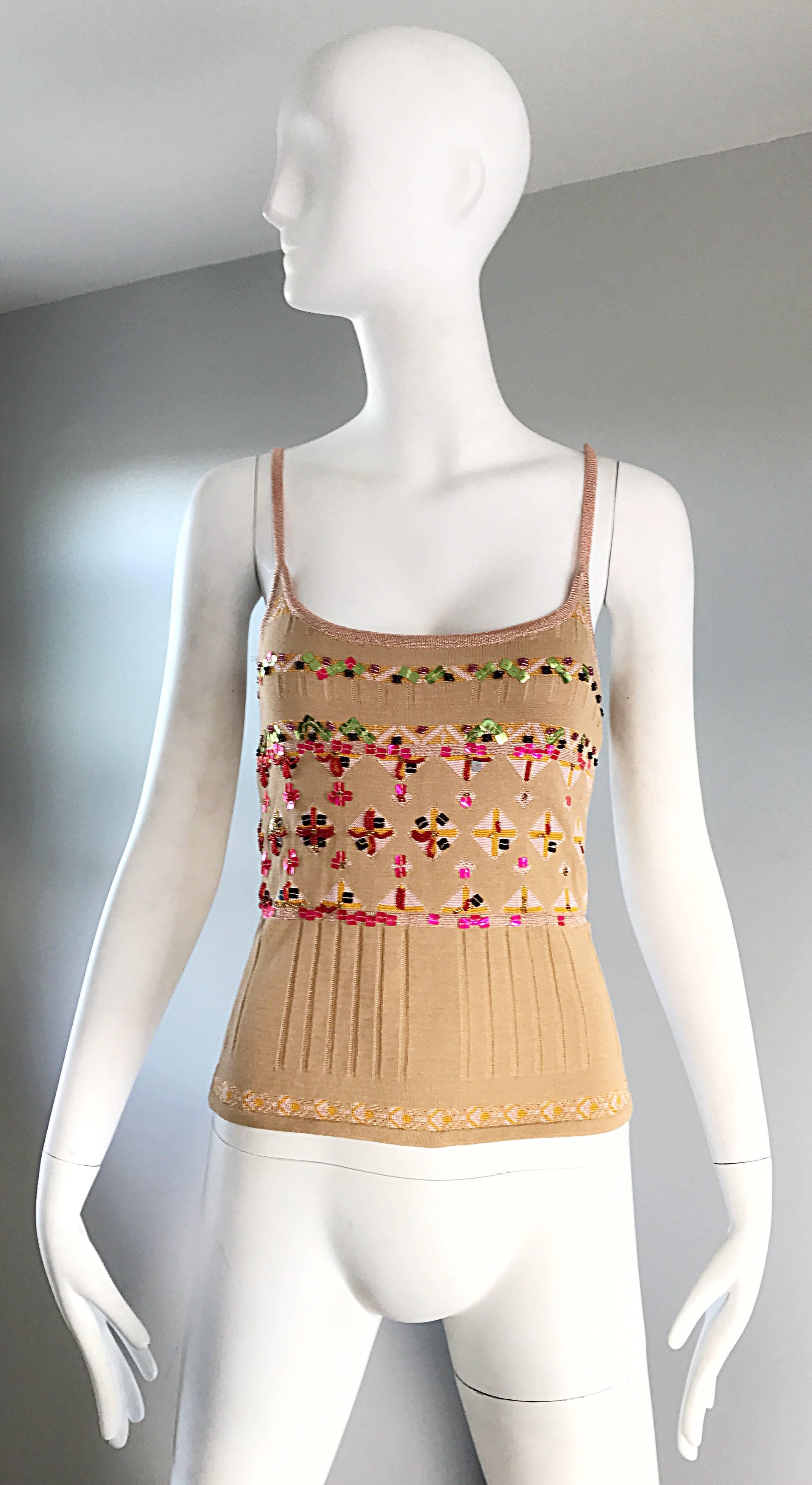 Beautiful vintage 90s CHRISTIAN LACROIX gold knit sweater top! Colorful embroidery throughout, with hand-sewn sequins mixed in. Rose gold metallic straps and along the bust. Couture quality, with heavy attention to detail. Rayon blend. Can easily be