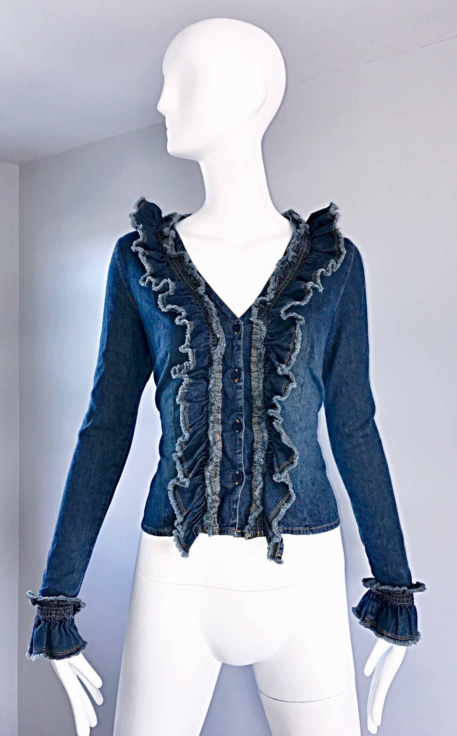 Fantastic vintage early 90s MOSCHINO denim shirt jacket! Wonderful fitted bodice buttons up the front. Dramatic ruffled collar that leads down both sides of the front bodice. Ruffle sleeve cuffs mirror the collar. Perfect soft lightweight cotton
