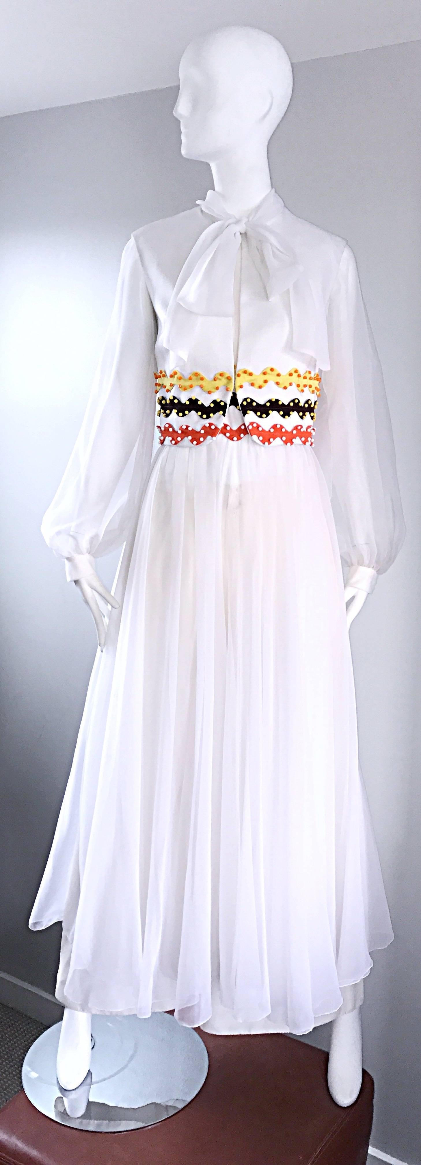 Amazing and super rare vintage OSCAR DE LA RENTA 3 piece chiffon jumpsuit! This has to be one of my favorite vintage pieces EVER! Consists of white wide leg trousers, a white vest with signature ric rac embroiderey (yellow, orange and brown) and