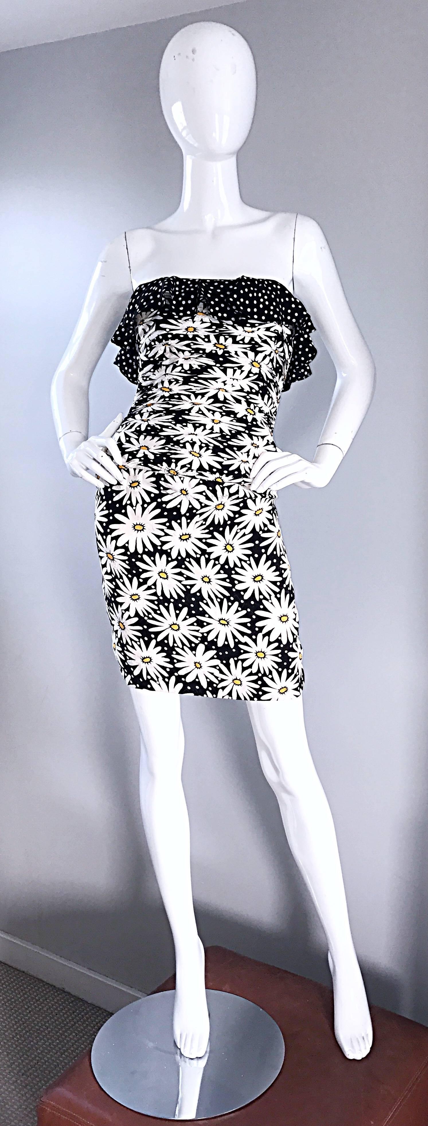 Fabulous vintage 1980s black and white silk strapless Bodycon dress! Features daisy flowers printed throughout a sea of polka dots. Ruched boned fitted bodice, with a ruffle detail above the bust. Super flattering fit looks great on the body. Hidden