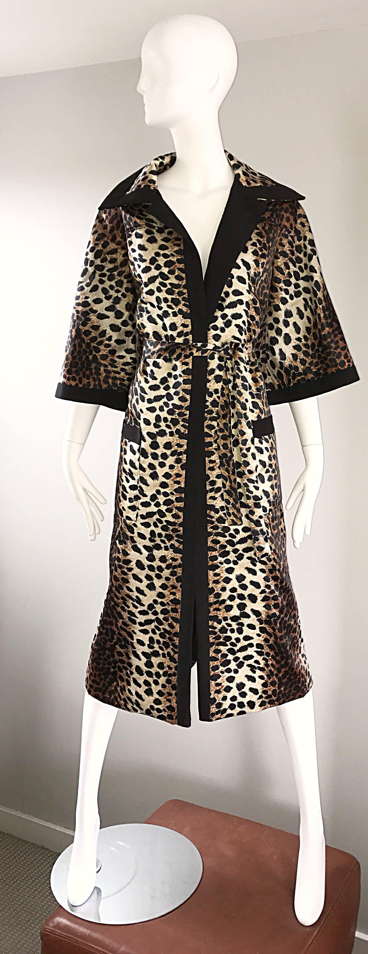 Fabulous vintage 1960s LILLI ANN leopard print belted trench jacket! Features chic 3/4 bell sleeves, and oversized lapels and collar. Patch pocket at each hip. Detachable matching belt. Timeless classic print that will last a lifetime! The perfect