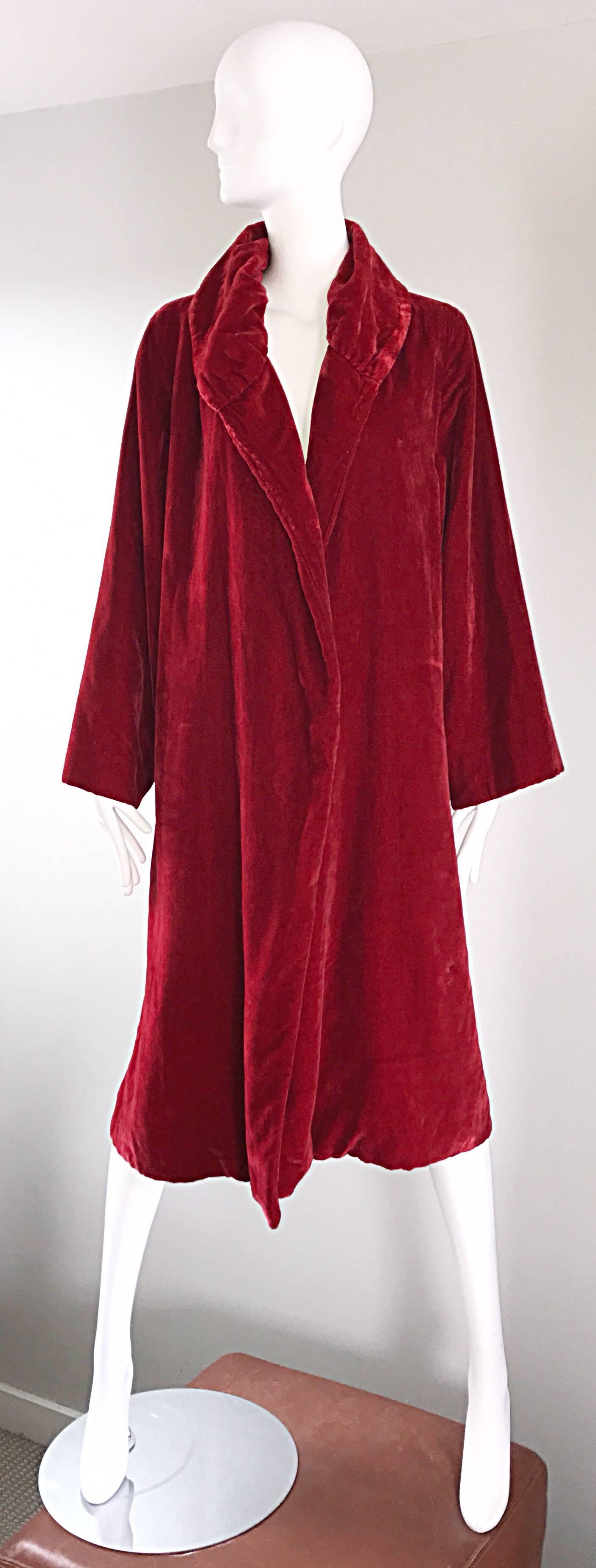 Luxurious 1920s blood red silk velvet flapper jacket! This gem features the softest velvet that I have ever felt! Vibrant red color. Intricately pleated detail at the collar. Interior hidden pocket. Looks great with jeans, or over a dress. Can also