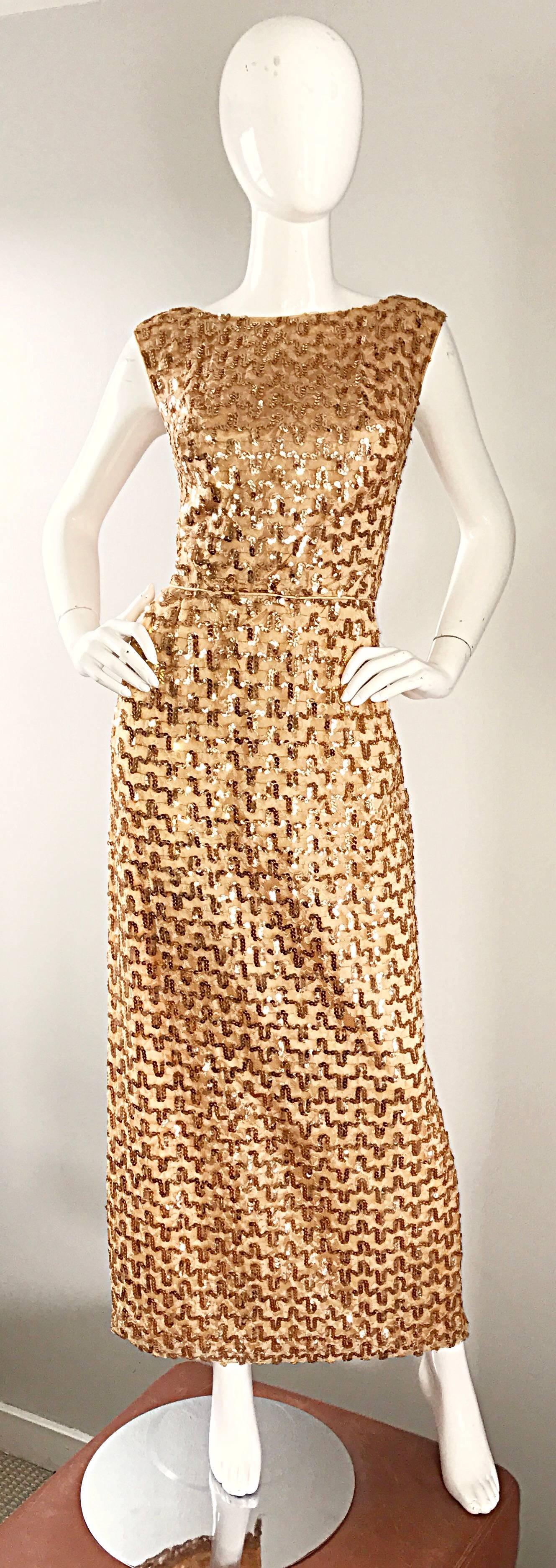 Amazing vintage 1960s fully sequined gold full length evening dress! Features thousands of hand-sewn gold sequins on lace throughout. Flattering tailored bodice, with a straight full length skirt. Full metal zipper up the back with hook-and-eye