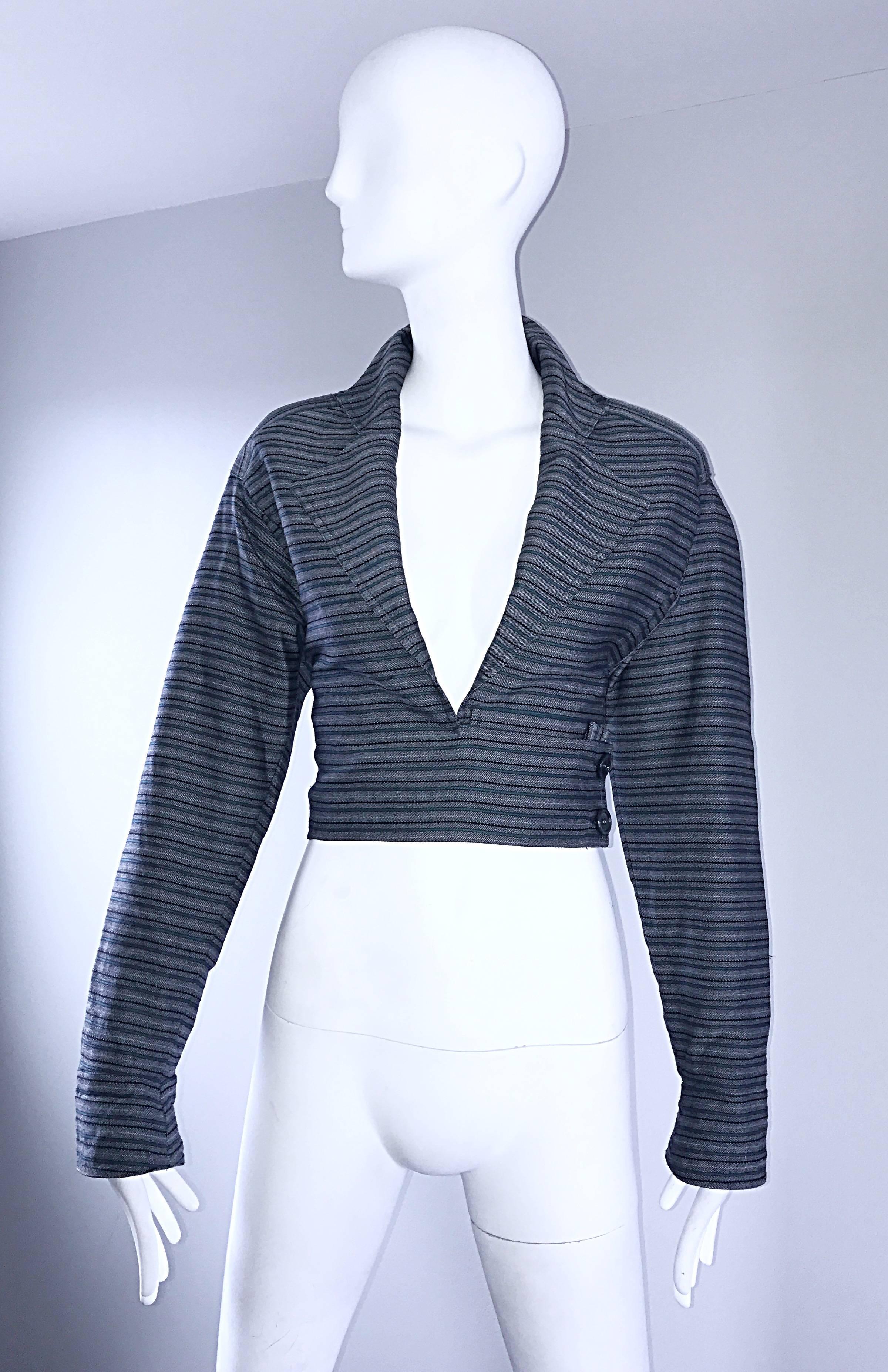 Chic vintage BERNARD PERRIS cropped bolero blazer! Features a combination of blue, green and gray stripes throughout. Avant Garde dolman sleeves make this beauty easy to wear by an array of sizes. Hidden interior button, and two buttons at the side.
