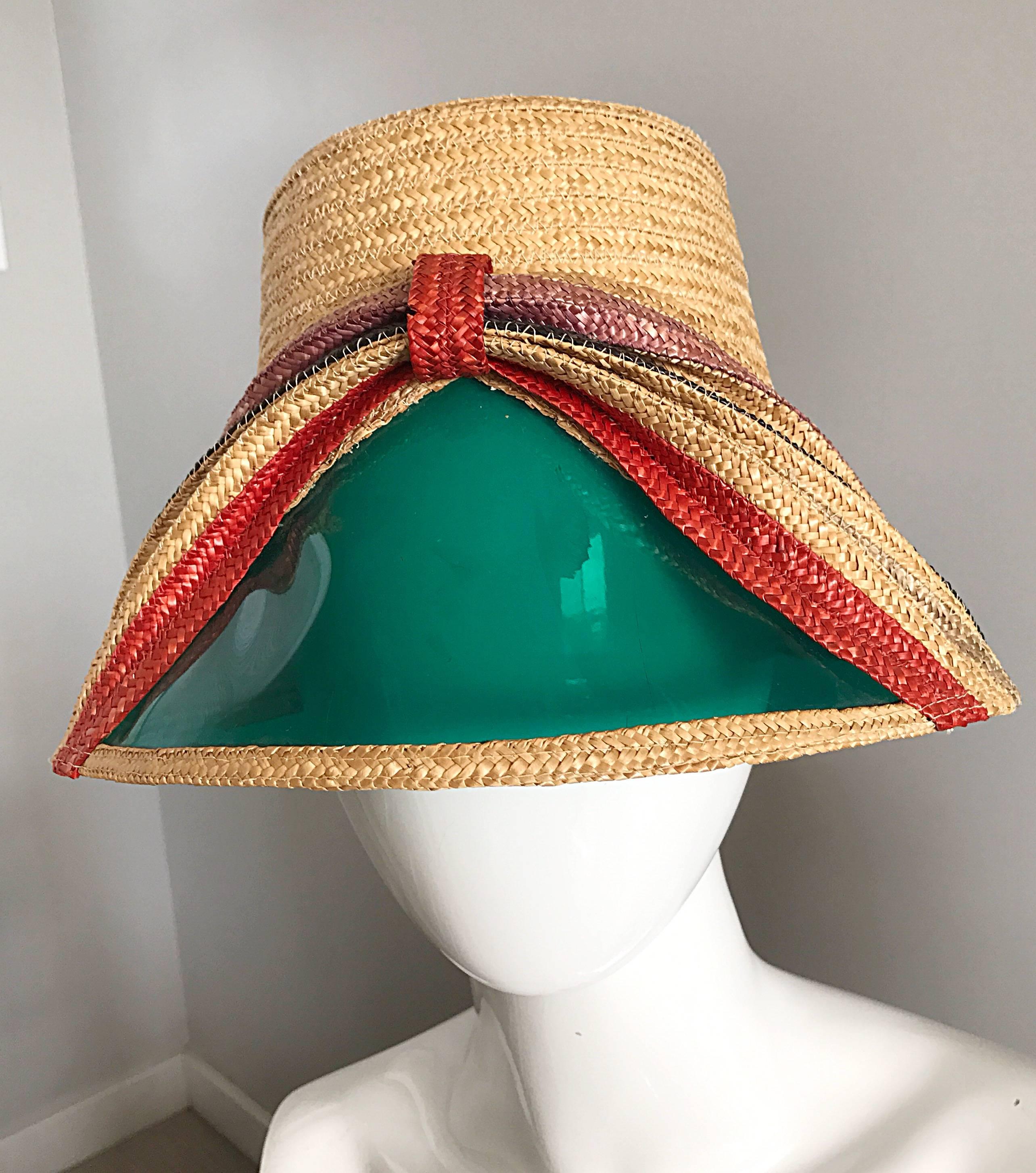 Rare 1960s straw hat with built in sunglasses / visor! Features a bow design in orange, violet, and tan on the front. Teal plastic see-through vinyl panel on the front. This hat is all-in-one! No need to worry about loosing your sunglasses with this