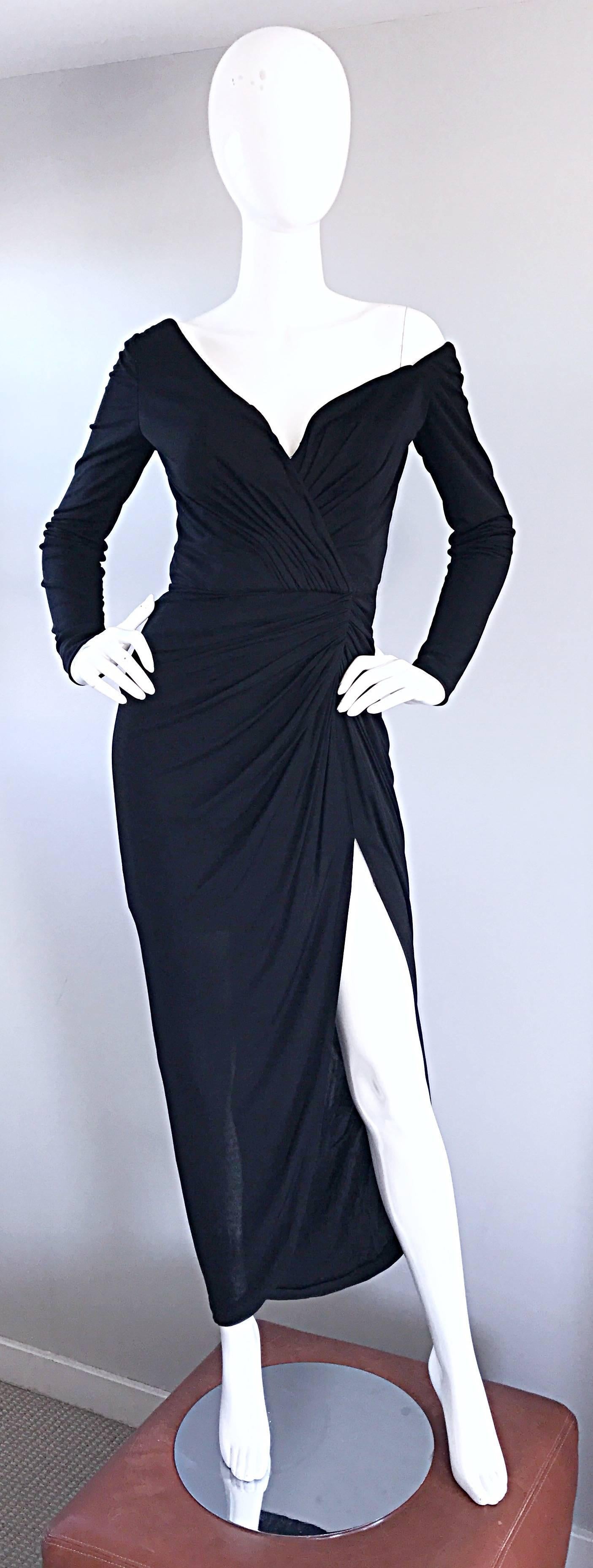 Amazing and sexy early 1980s VICKY TIEL COUTURE black silk jersey evening dress! Unique, yet flattering asymmetrical cut, with one of the sleeves sitting off the shoulder. Flattering ruched boned bodice that stretches to fit. Daring thigh high slit.