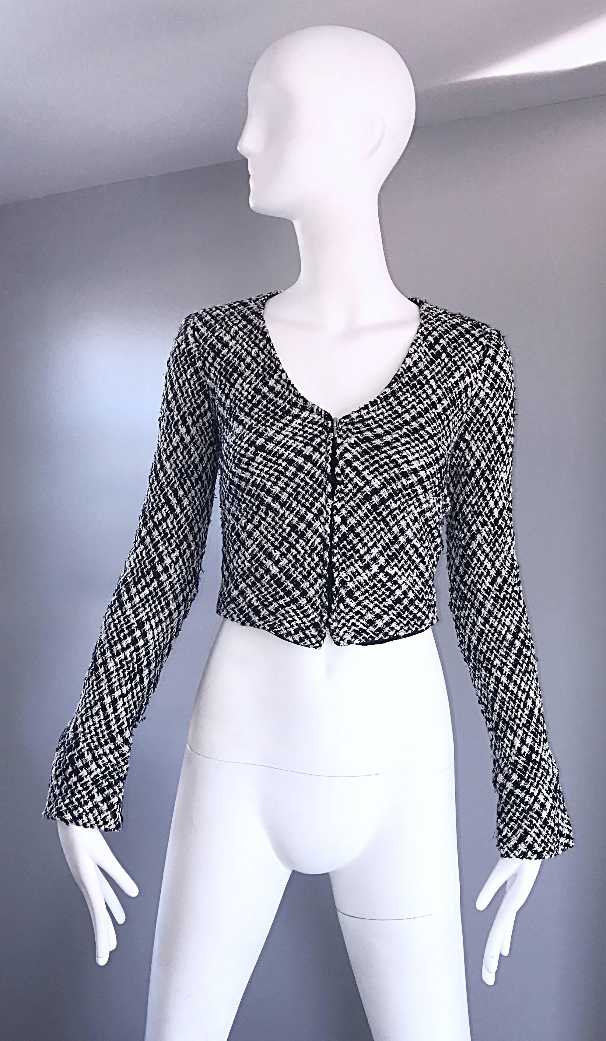 Chic vintage AGNES B early 1990s black and white cropped jacket! Features  black and white threading. Slim tailored fit, with slightly flared sleeves. Full metal zipper up the front. Extremely versatile and timeless piece! Full lined. 
Soft