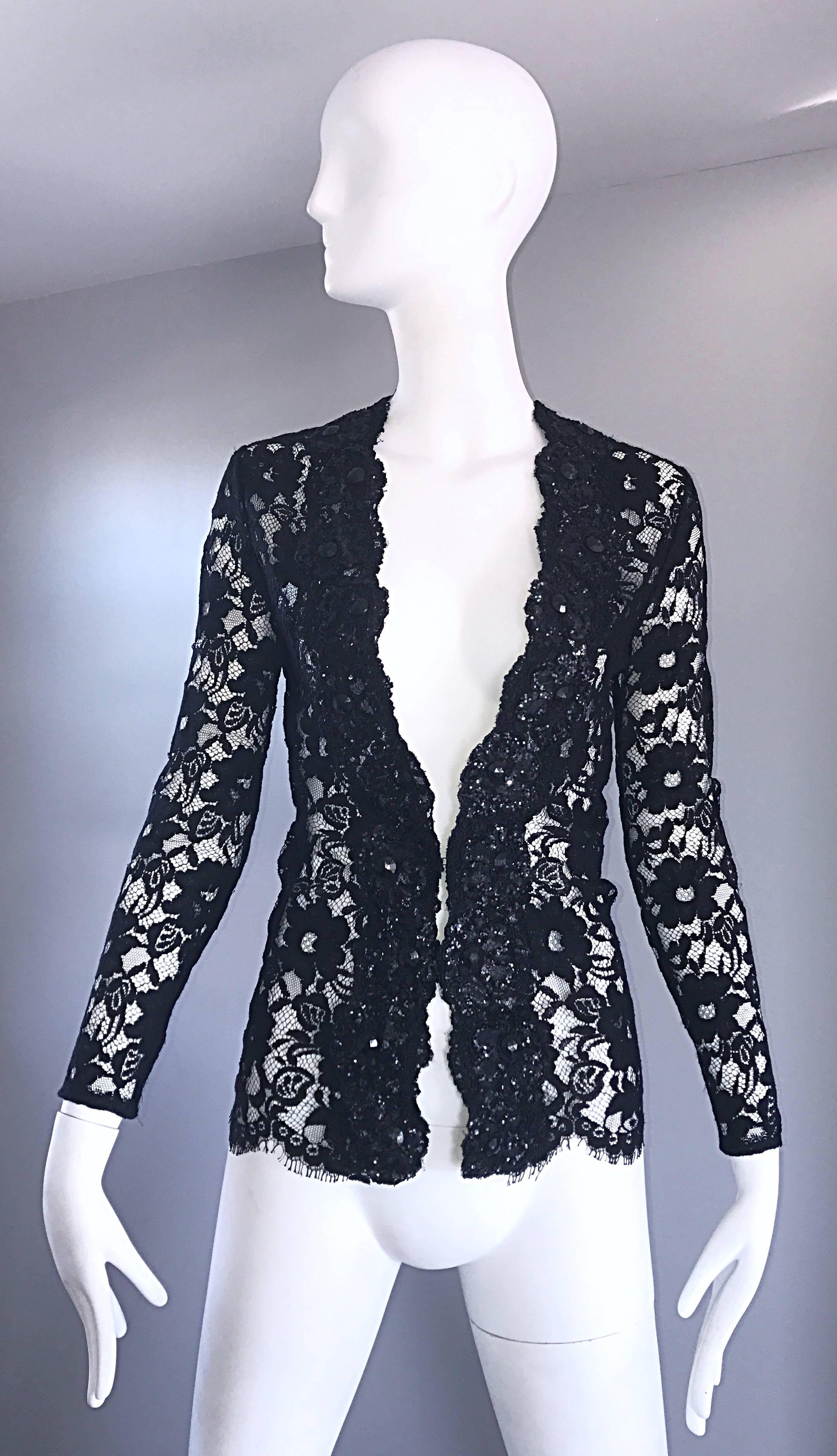 Beautiful vintage VICKY TIEL COUTURE black chantilly lace beaded and sequined top or jacket! Features hundreds of hand-sewn sequins and beads throughout the front bodice. Single hook-and-eye closure. Can easily be dressed up or down. Great with