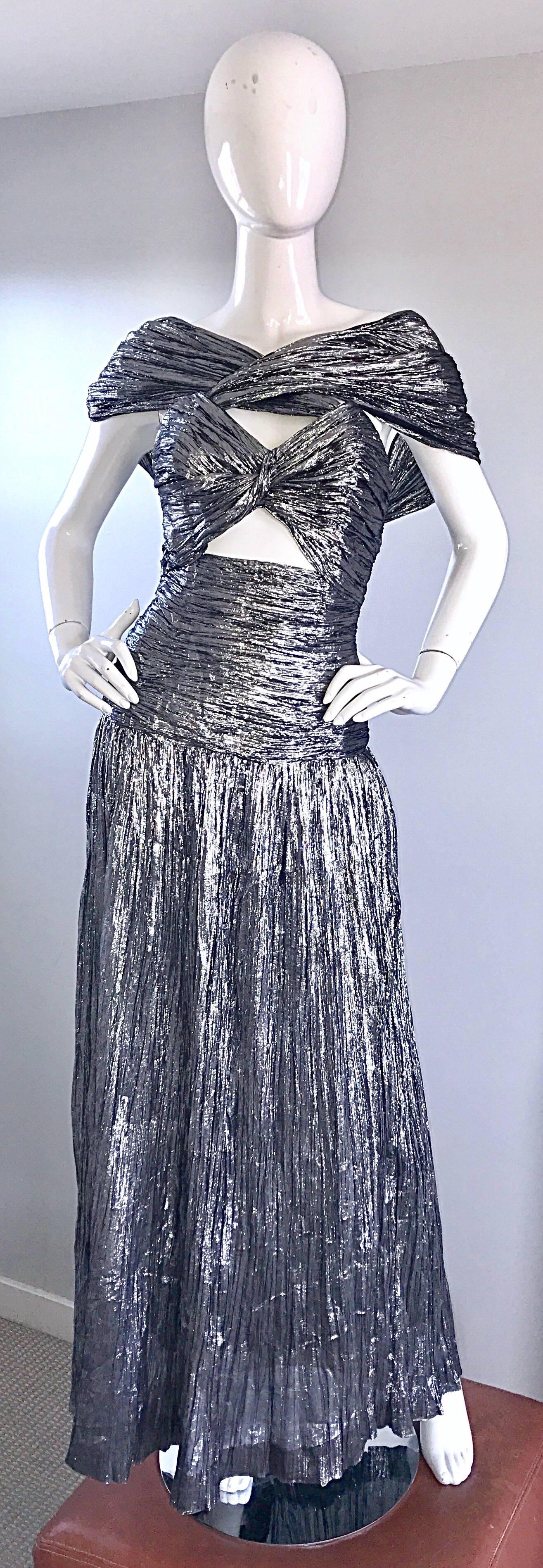 Simply sensational 70s TED LAPIDUS HAUTE COUTURE metallic silver silk plisse Avant Garde cut-out evening dress! Features attached straps that can be worn across the bust to form a shawl like appearance. Cut-out below the bust reveals just the right