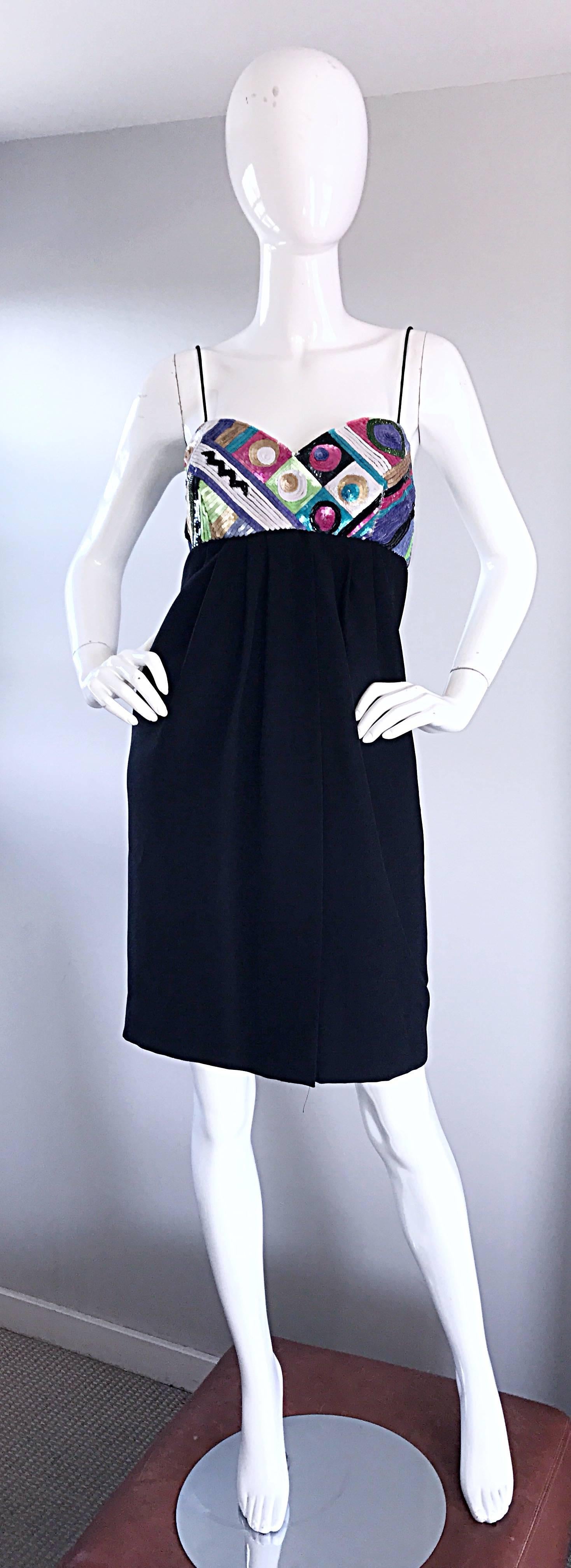 Chic vintage early 1990s LIYIZ black crepe and sequin babydoll empire dress! Flattering high empire waist is very forgiving. Thousands of hand-sewn colorful sequins on the bodice in geometric shapes. Intricate pleating detail on the skirt. Hidden