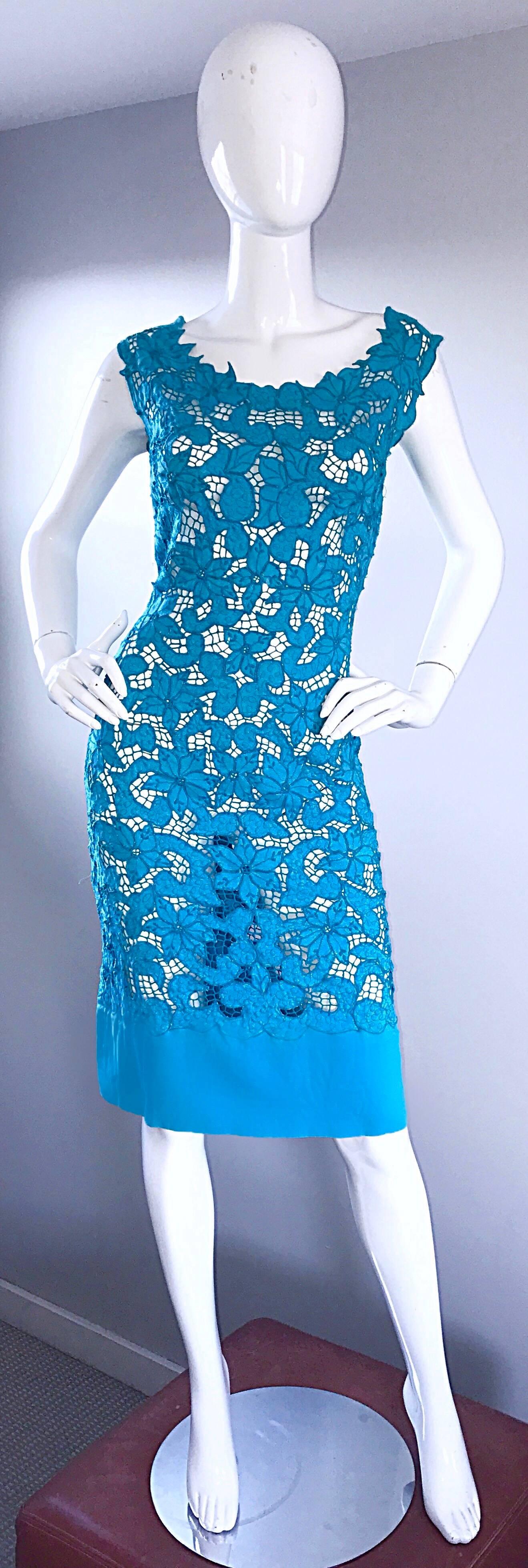 Incredible vintage 1950s Demi couture cut-out flower crochet wiggle dress! Mostly hand-sewn, with an amazing amount of detail! Vibrant turquoise blue color. Sleevless cap sleeves, with a solid hem. Full metal zipper up the back with hook-and-eye