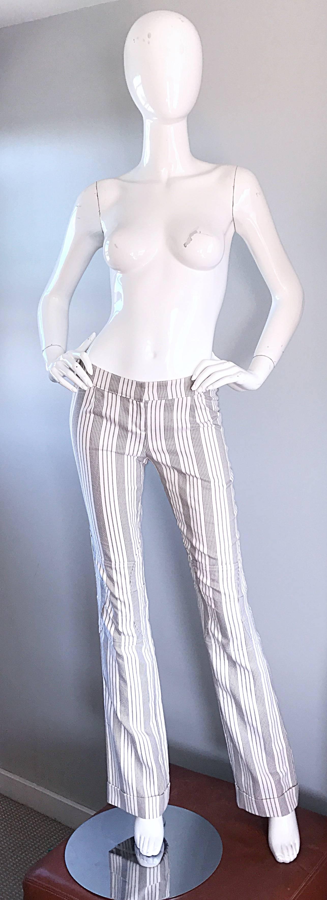 Flattering Vintage 2000s CHRISTIAN DIOR by JOHN GALLIANO cotton grey and white Pinstripe wide flared led cuffed pants! Embroidered detail at knees. Can easily be dressed up or down. Looks amazing on!
Made in France.
Marked Size US 6
Measurements: