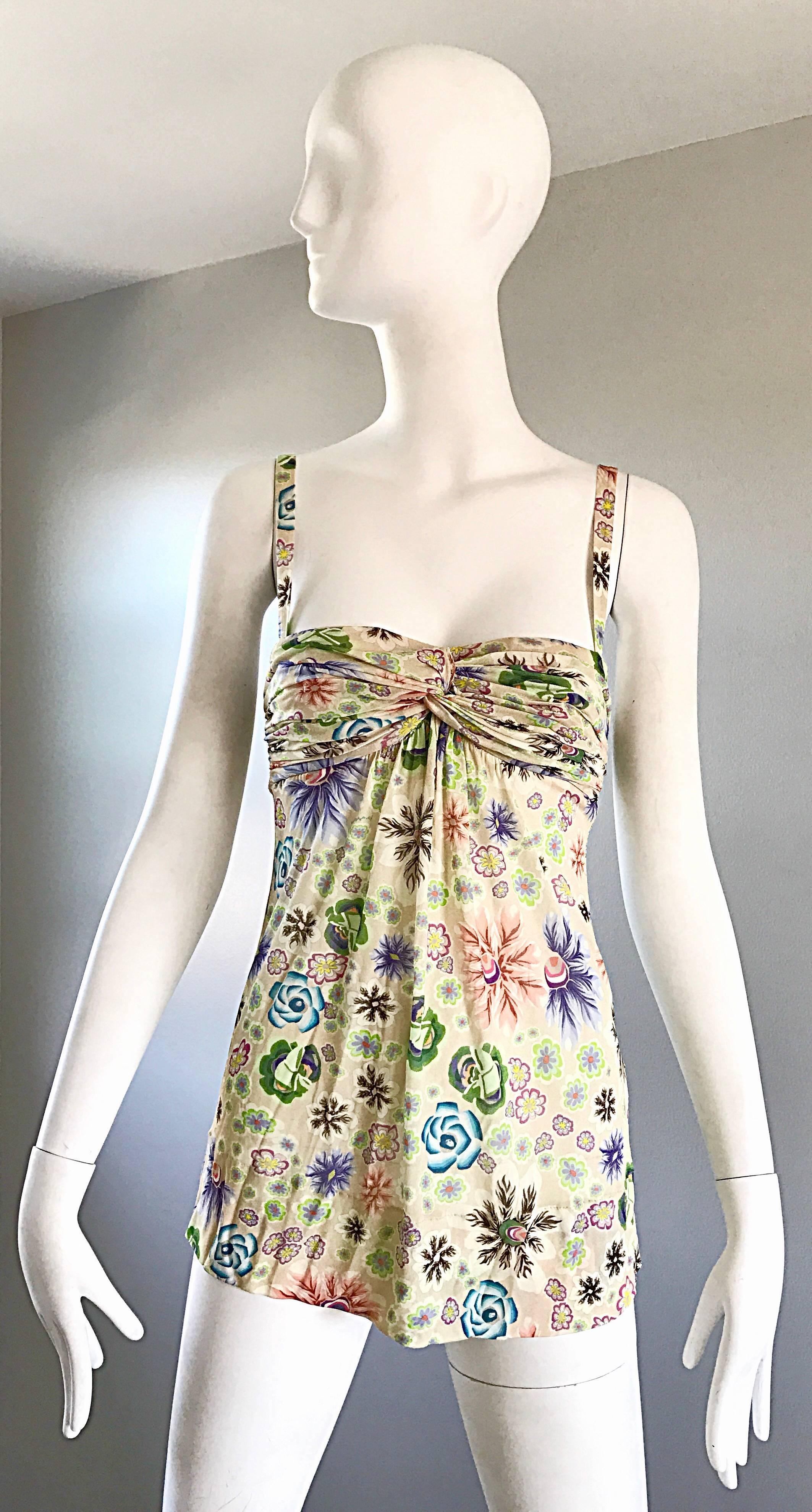 Wonderful vintage 90s MISSONI silk + rayon jersey empire waist sleeveless top! Features flowers in vibrant hues of green, purple, blue and pink throughout. Missoni logo printed in pink throughout. Adorable ball buttons up the back. Amazing colorful