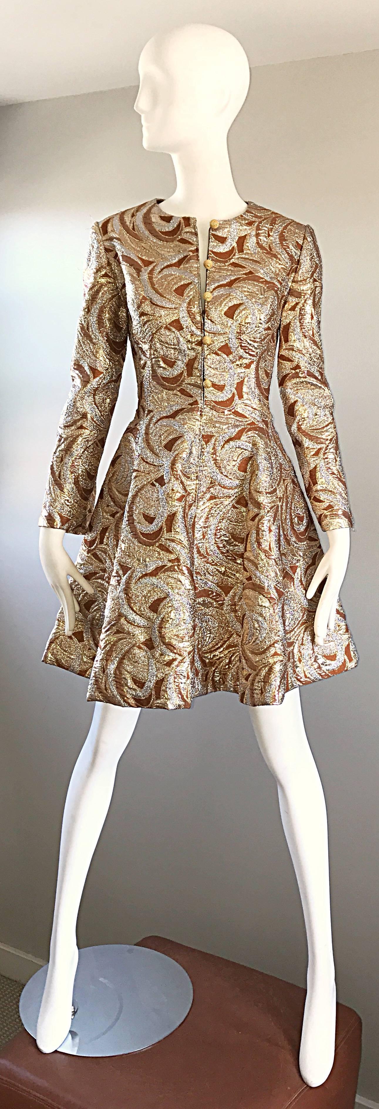 Amazing vintage 60s RICHARD TAM for NEIMAN MARCUS bronze, gold and silver metallic SPACE AGE fit n' flare silk mod brocade dress! Features a fitted bodice, with a flared Avant Garde skirt. Gold silk corded mock buttons up the bodice, with a hidden
